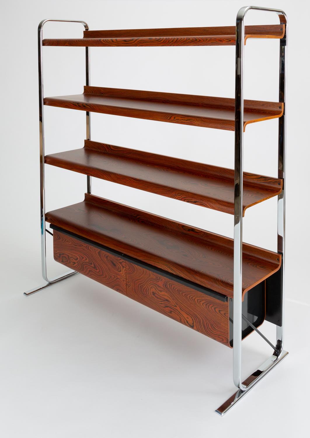 A combination shelving unit for books and storage from Peter Protzmann's Tubular collection for Herman Miller. Manufactured only from 1970-1971, the office design features drawers and shelves suspended between two frame runners of chrome-plated