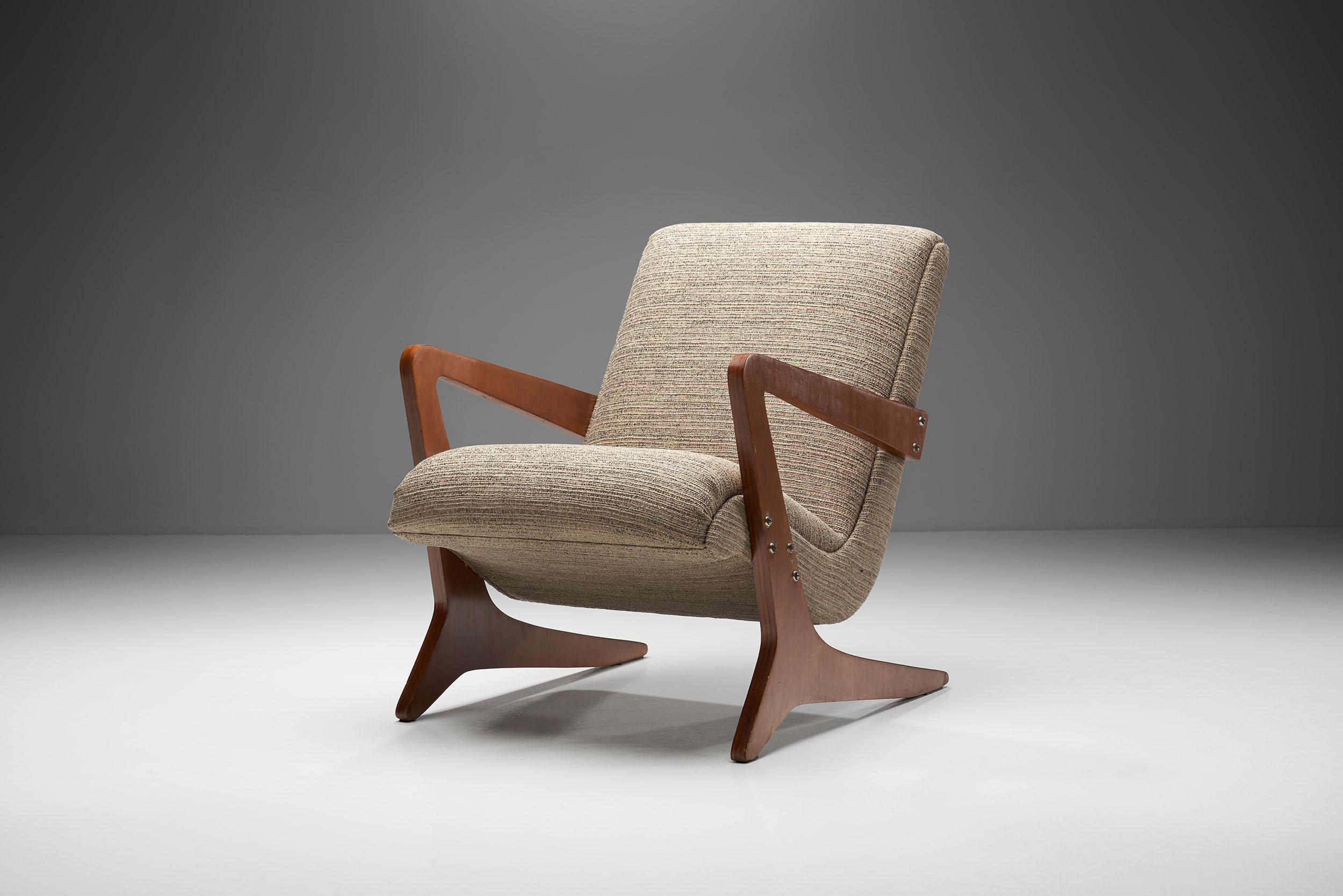 This characteristic “Zeca” armchair was designed by the pioneering Brazilian designer, Jose Zanine Caldas. Made of solid wood, this armchair was named after the childhood nickname of the designer.

Zanine Caldas is often referred to as the “Master