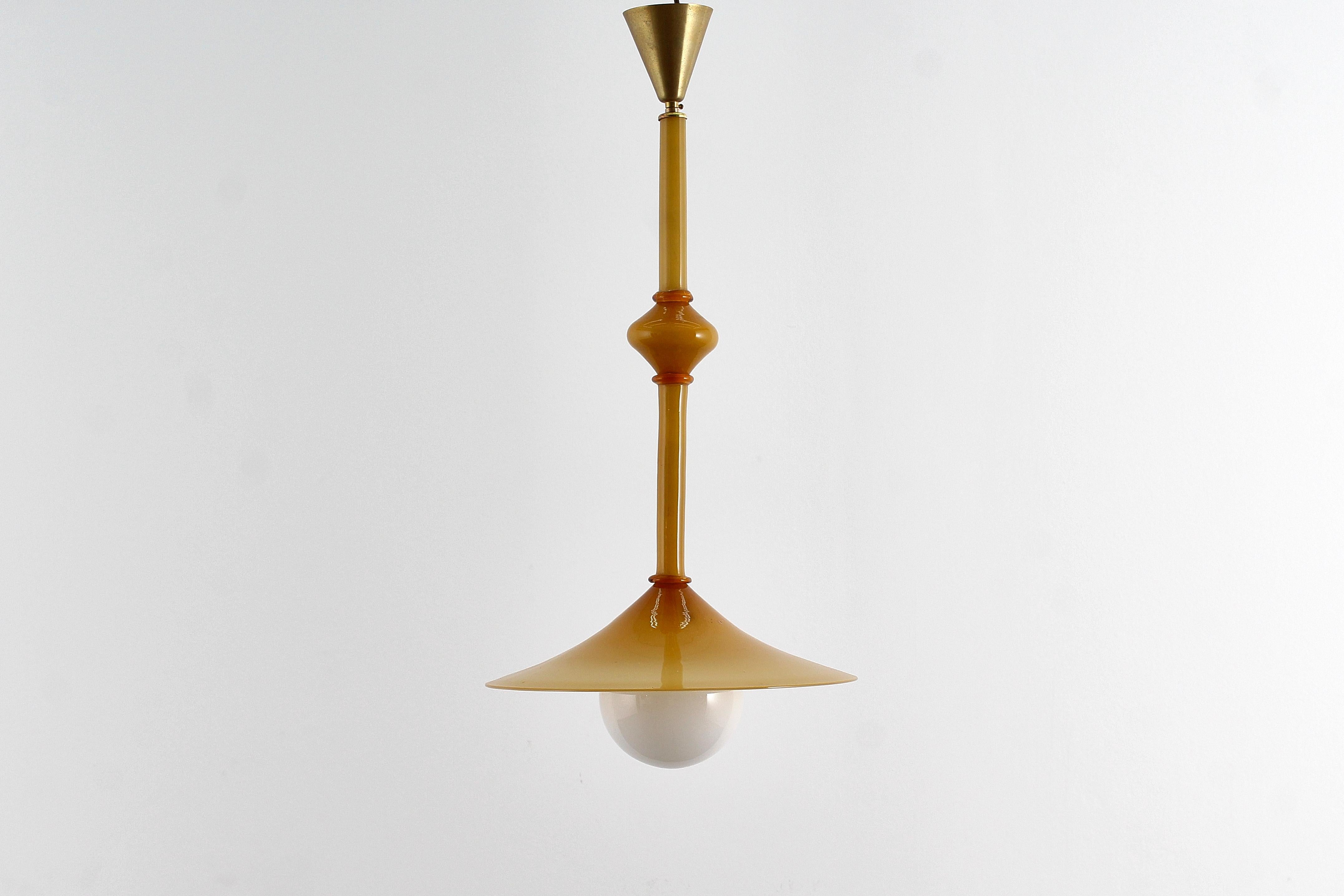 Rare amber-colored Murano blown and cased glass chandelier. Made in Italy by the prestigious Zecchin Martinuzzi glassworks, 1930s.
Where consistent with age and use.