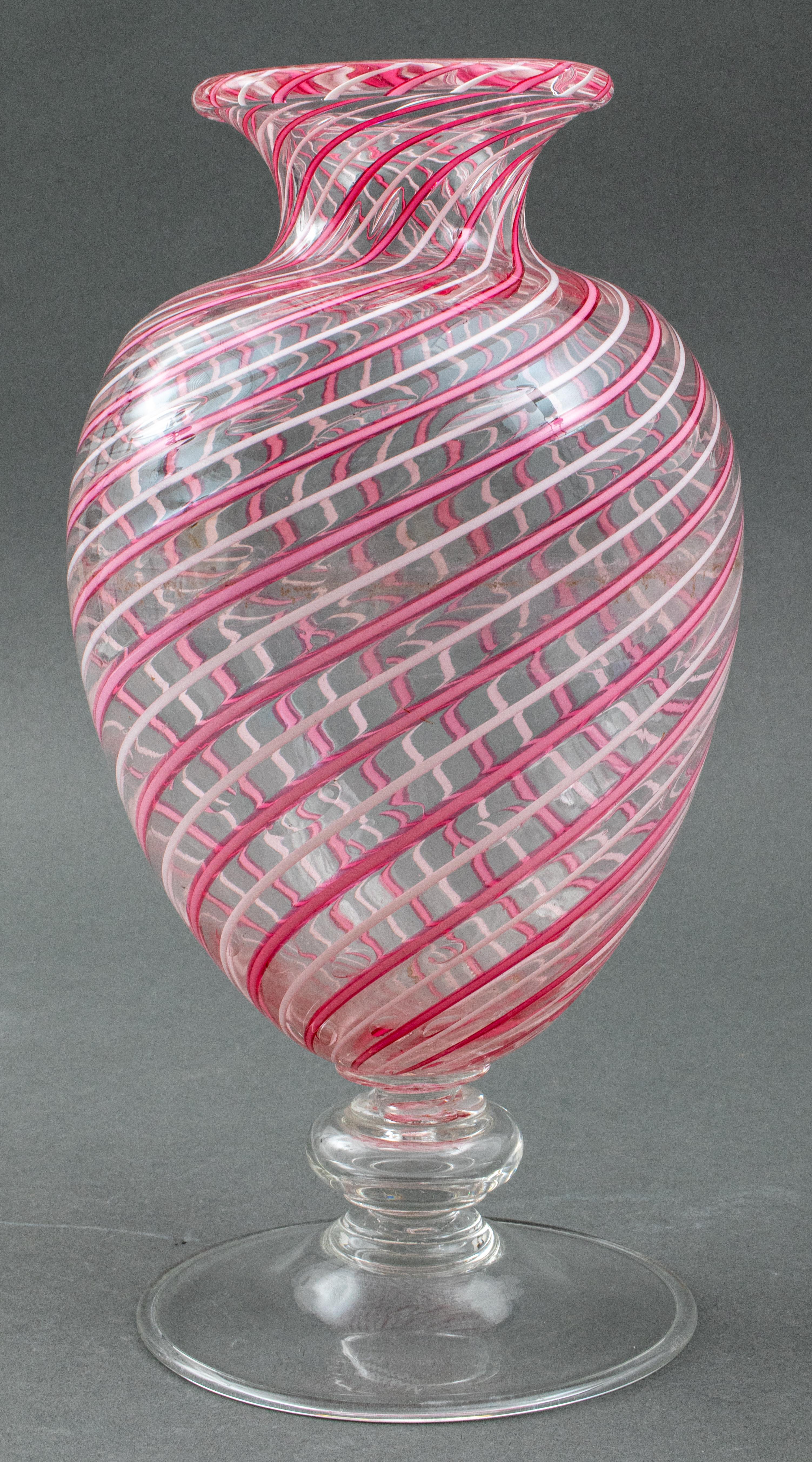 Italian Murano art glass 'Veronese' baluster shape vase by Vittorio Zecchin for Venini, twisted clear, white and pink glass with controlled bubble inclusions, marked 'Venini Murano Italia' on the bottom, circa 1925. 11.75