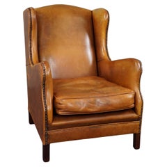 Antique Zeer comfortabele en mooi gekleurde schapenleren fauteuil