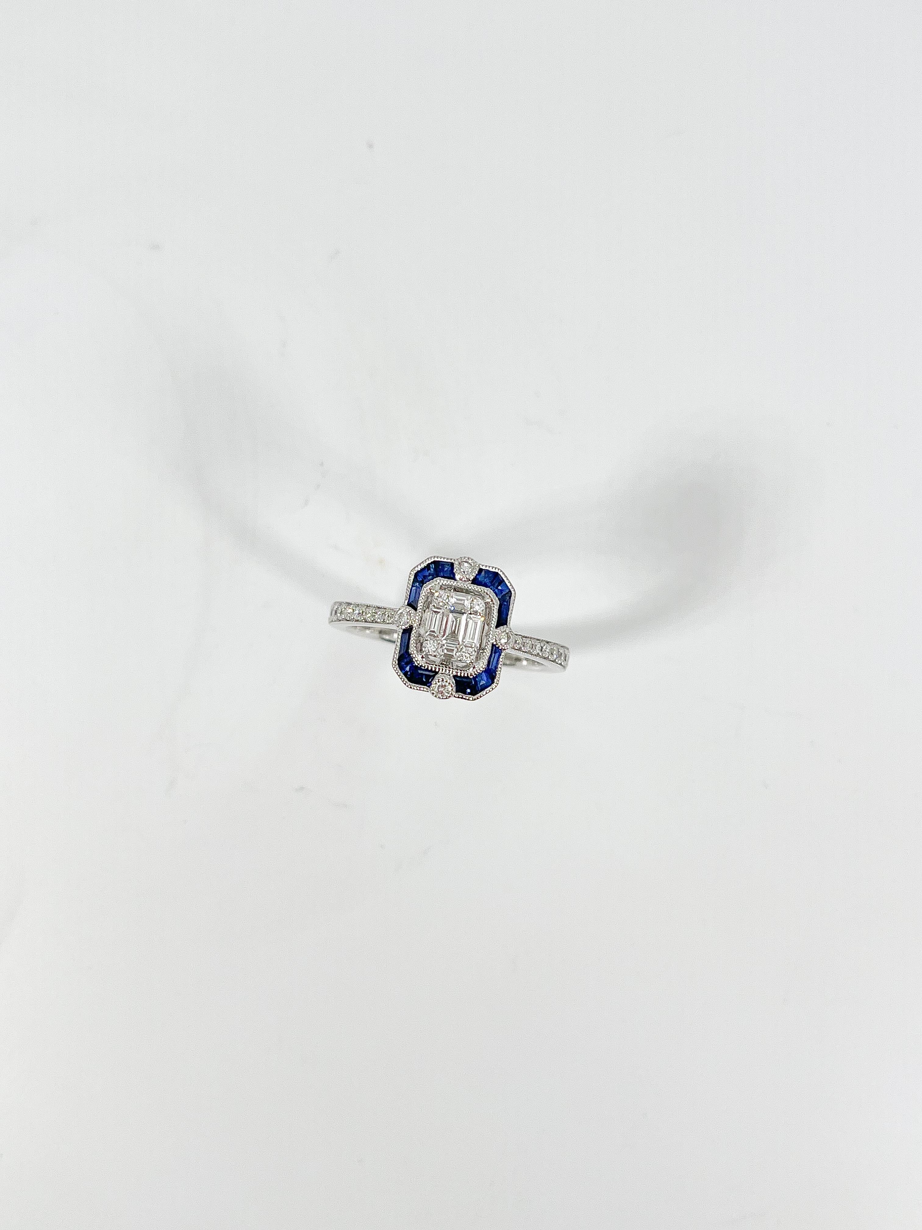 Zeghani 14k white gold .14 CTW Sapphire and .18 CTW diamond ring. The diamonds in this ring are round and baguette, the sapphires are intricate cut, the size of the ring is a 6 1/2, and it has a total weight of 3.6 grams.