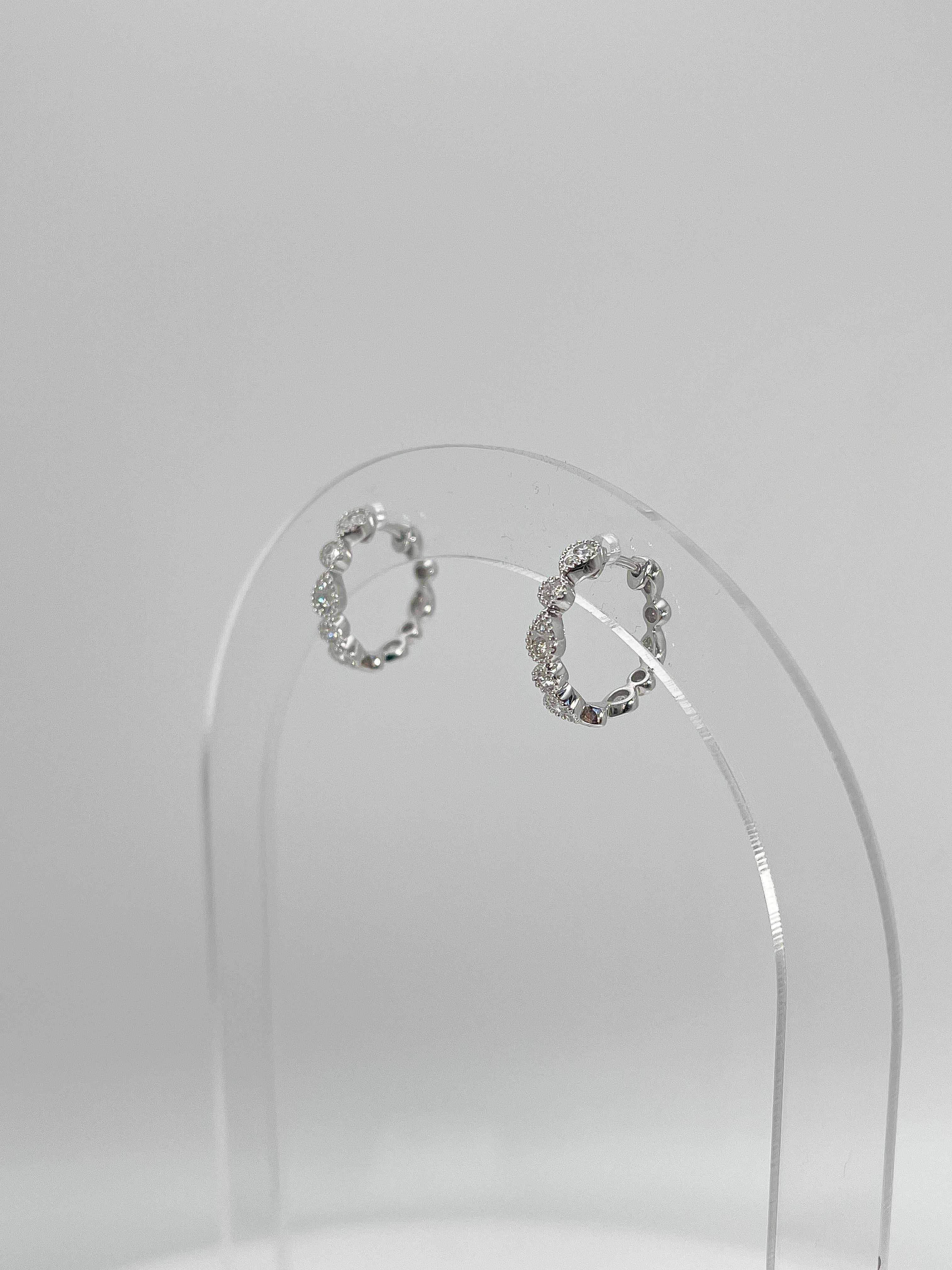 Zeghani 14K White Gold .24 CTW Diamond Huggie Hoop Earrings In Excellent Condition For Sale In Stuart, FL