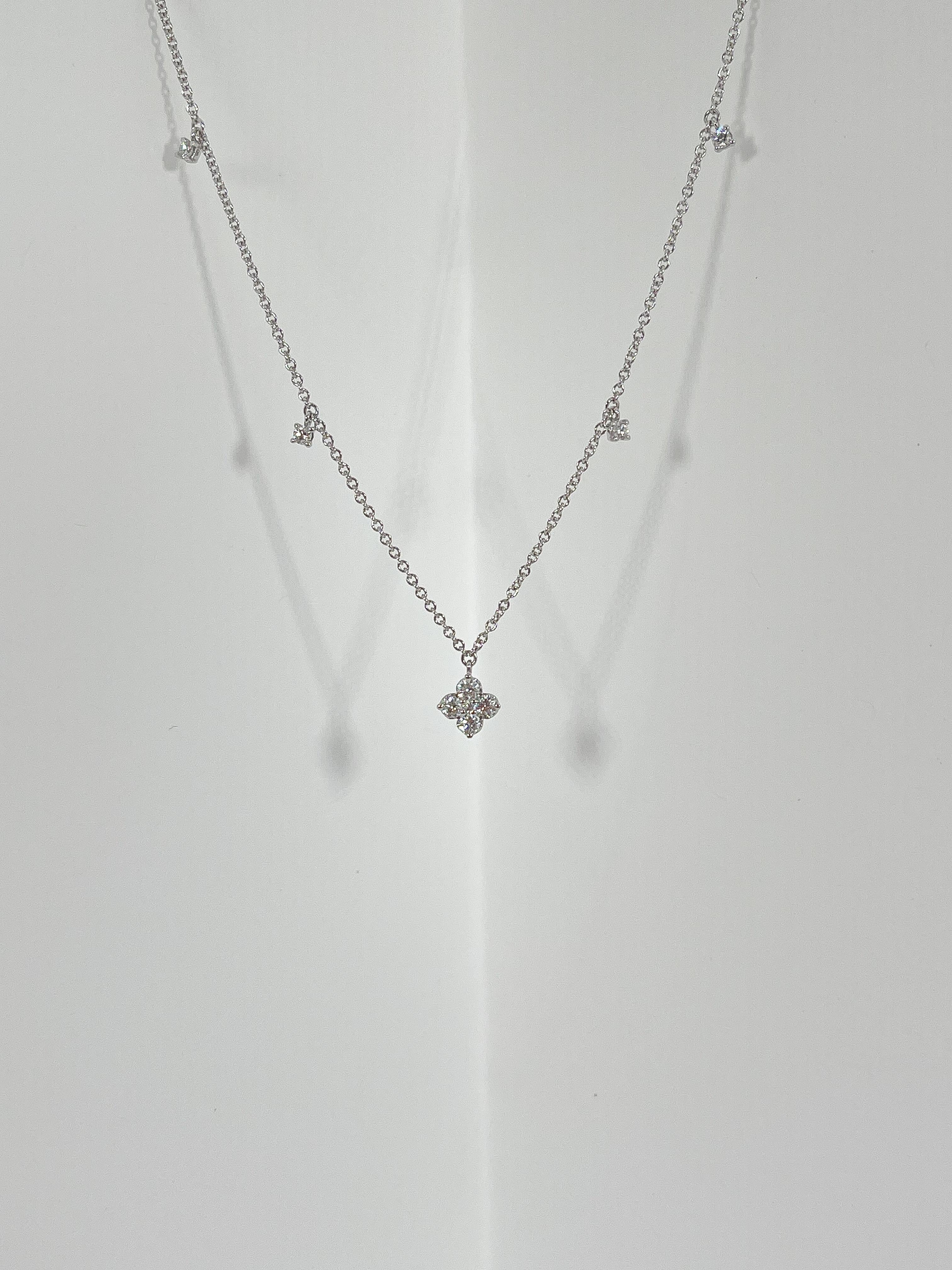 Zeghani 14k white gold .32 CTW diamond pendant and diamond drop necklace. The diamonds in this necklace are all round, has a lobster clasp to open and close, the length is 18 inches, the width of the pendant is 6.7 mm, and it has a total weight of