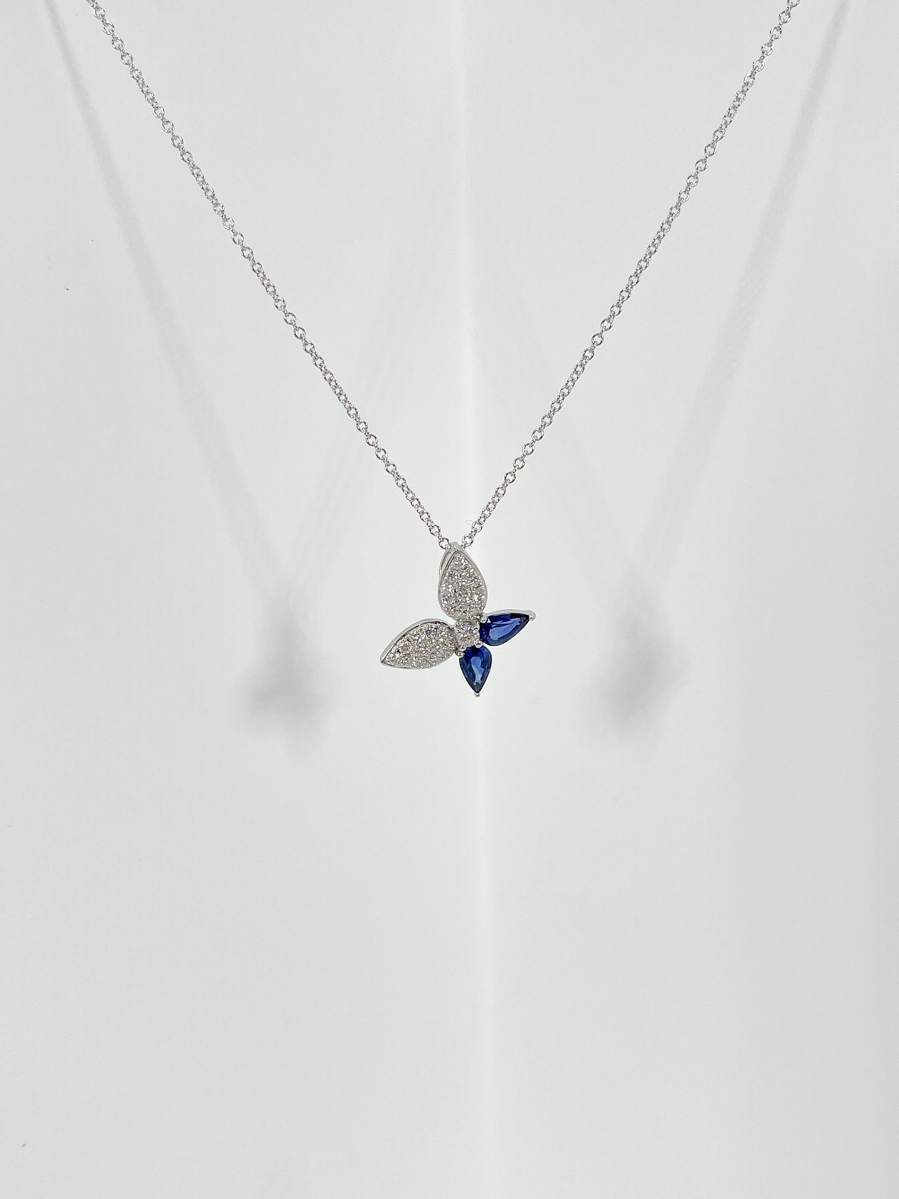 Zeghani 14k white gold sapphire and diamond pendant necklace. The diamonds in this necklace are all round, has a lobster clasp to open and close, the sapphires are pear shaped, the length of the necklace is 19 inches, the width of the pendant is 13