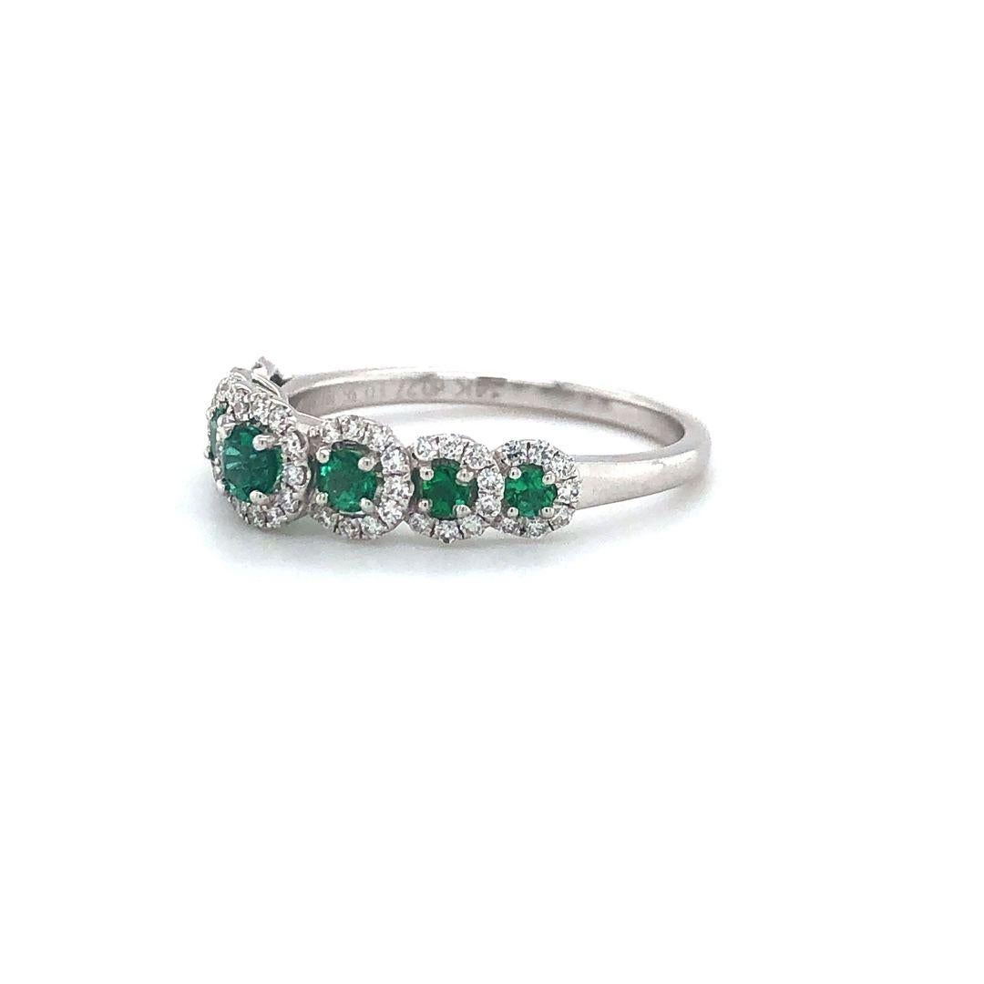 Zeghani Emerald and Diamond Halo Band Ring 14k White Gold Size 6.5

Condition:  Excellent Condition, Professionally Cleaned and Polished
Metal:  14k Gold (Marked, and Professionally Tested)
Gemstone:  Seven Round Cut Emeralds .36ctw
Diamonds:  Round