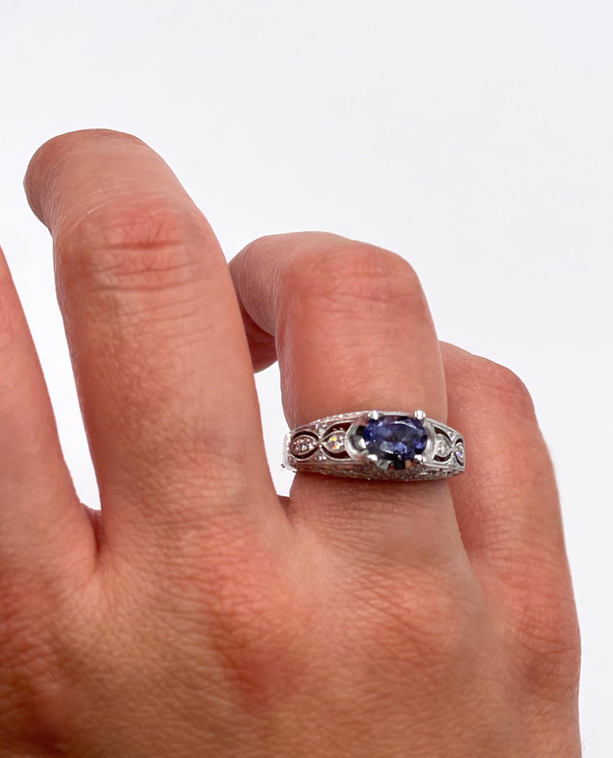 Details in every angle! 14K white gold ring made by Zeghani decorated with scallop and milgrain detailing and has round diamonds totaling 0.41 carats. In the center there is one oval-shaped iolite measuring 7x5mm.

* Finger size 6.5 (can be sized up