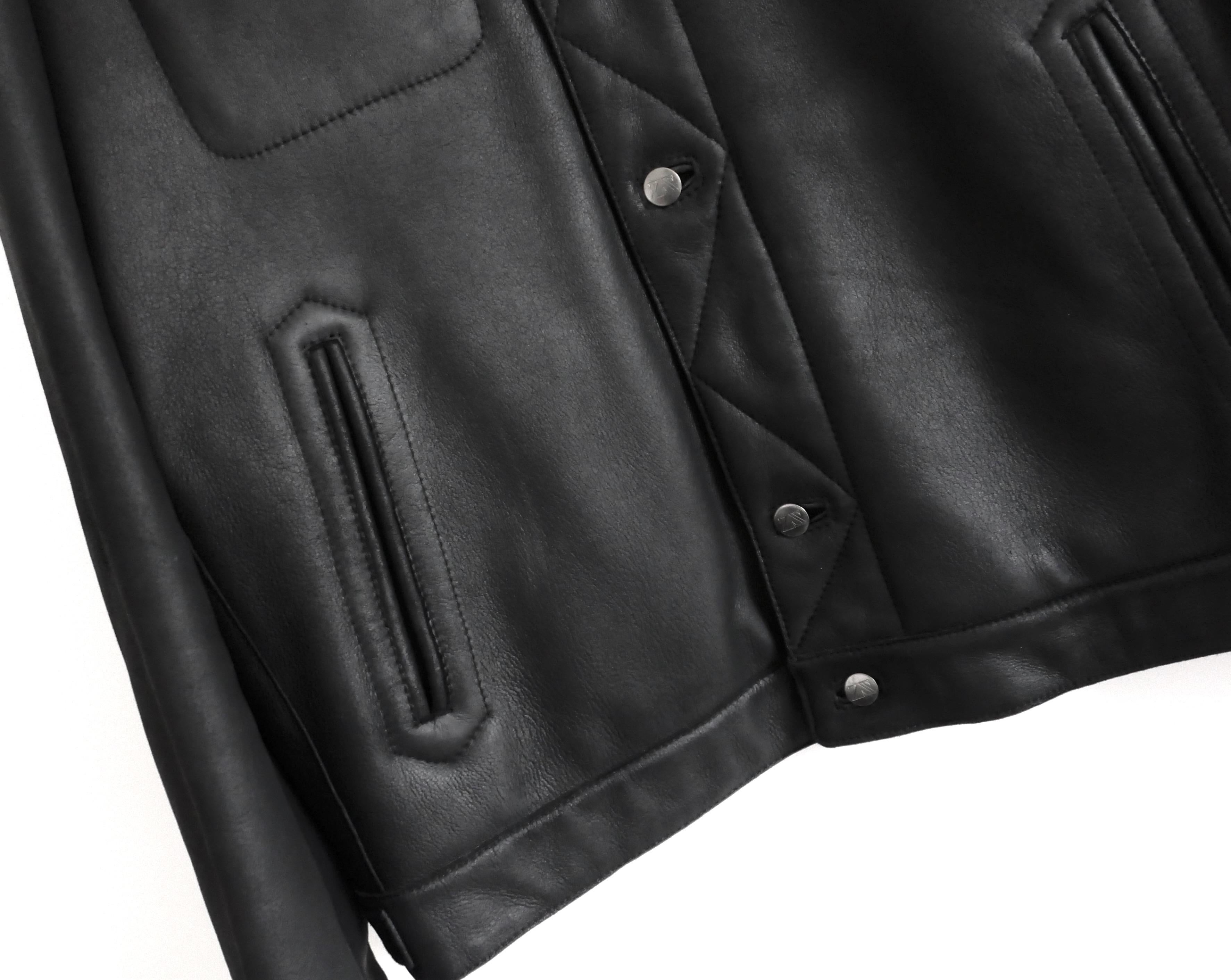 Gorgeous Zegna Sport shearling lined leather coat. Unworn with dustbag. Made from ultra supple black lambskin with snug shearing lining, it has a hip length cut with embossed silver tone rivet buttons, patch and welt pockets and stitched placket
