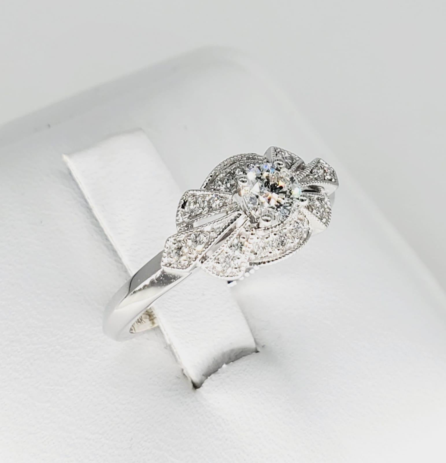 Zei 0.50 tcw Diamonds 14k White Gold Engagement Ring. Beautifully mastered design making the center diamond standout without hiding any beauty from the diamonds surrounding it. The ring is made by famous jewelry maker Zei and has an Art Deco Style