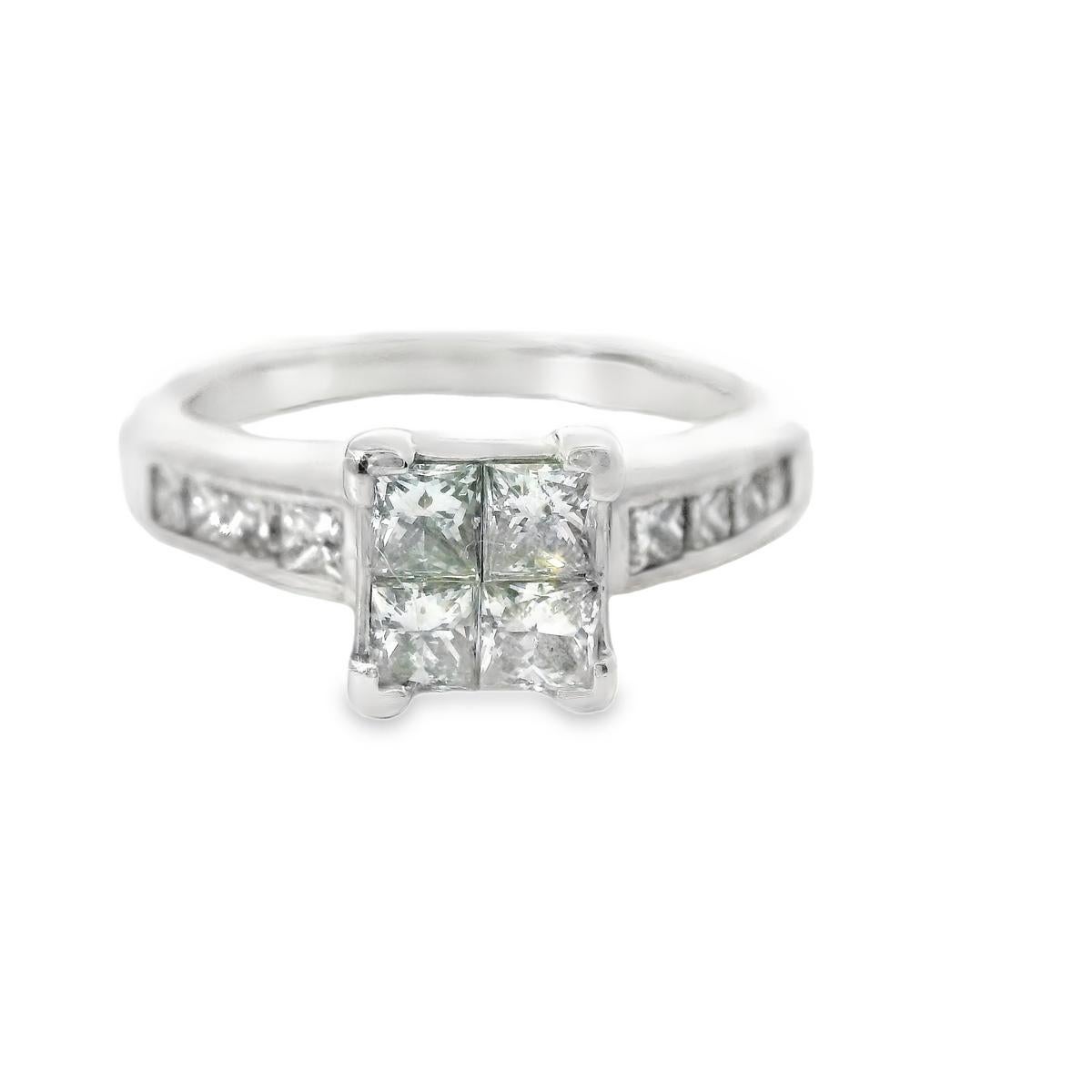 This stunning illusion set diamond engagement ring is more than 1.00 ct in natural diamonds.  There are 12 princess cut diamonds, SI1-SI2 clarity, I-J in color set in 3.9 grams of 14K white gold.  The ring is a size 4.75 but can be sized by your