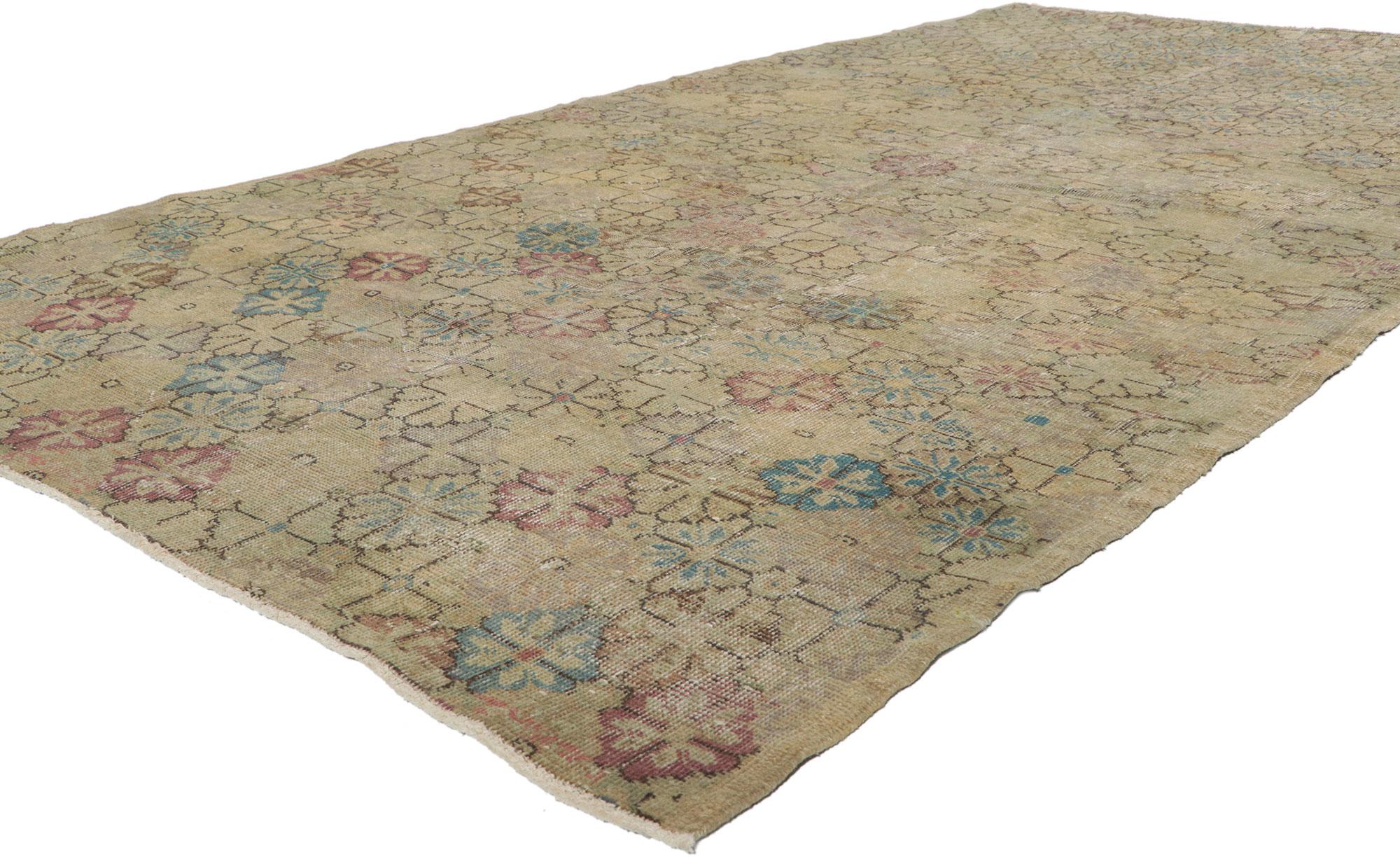 50876 Zeki Muren Distressed Vintage Turkish Sivas Rug. 
Lovingly timeworn with Gustavian grace, this hand knotted wool distressed Turkish Sivas rug beautifully embodies a Swedish Farmhouse style. The field is covered in stylized eight petal rosettes