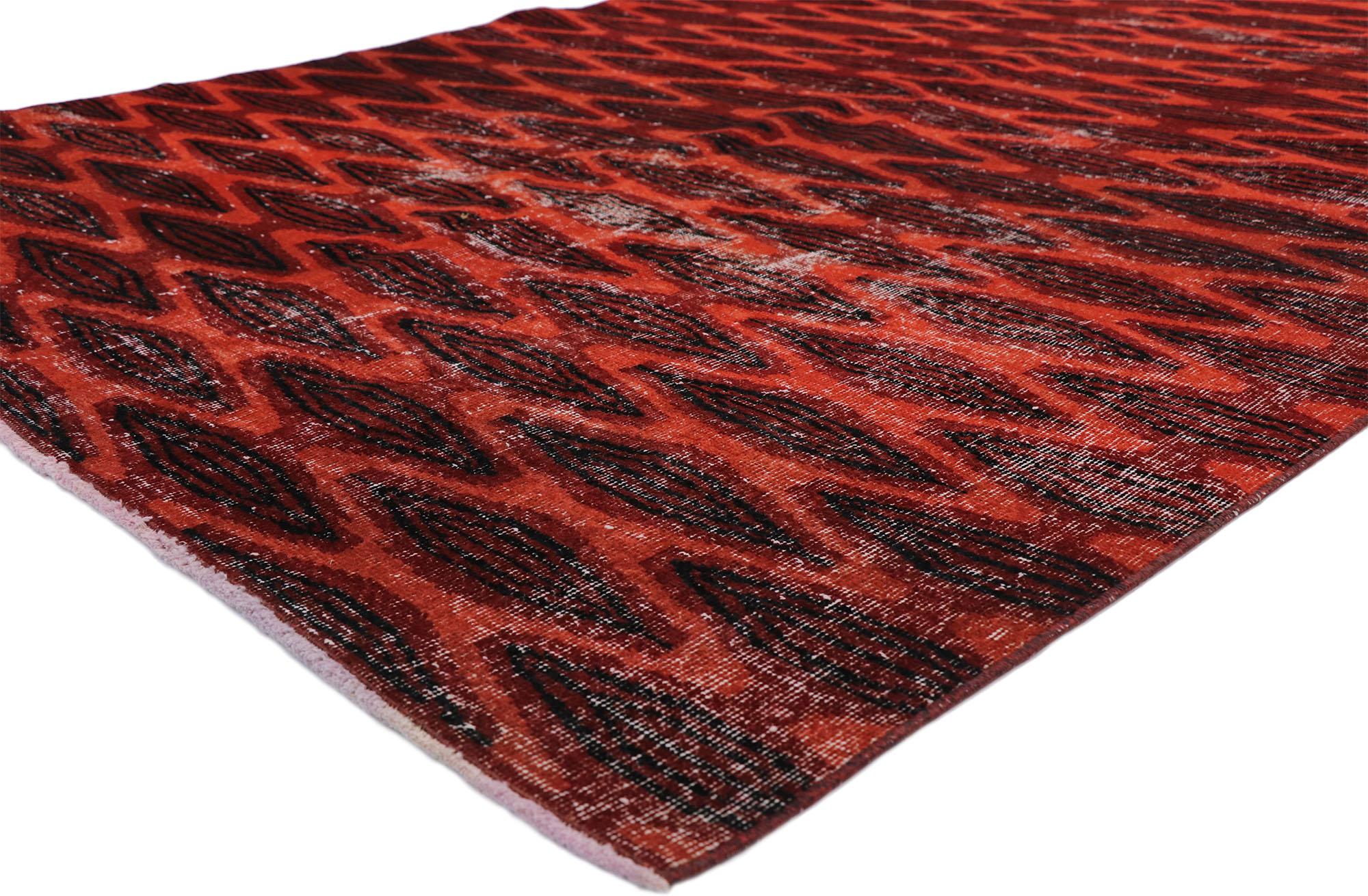 52589, Zeki Muren distressed vintage Turkish Sivas rug with Elizabethan Art Deco style. This hand knotted wool distressed vintage Turkish Sivas rug features an all-over diamond lattice pattern spread across an abrashed red field. Columns of