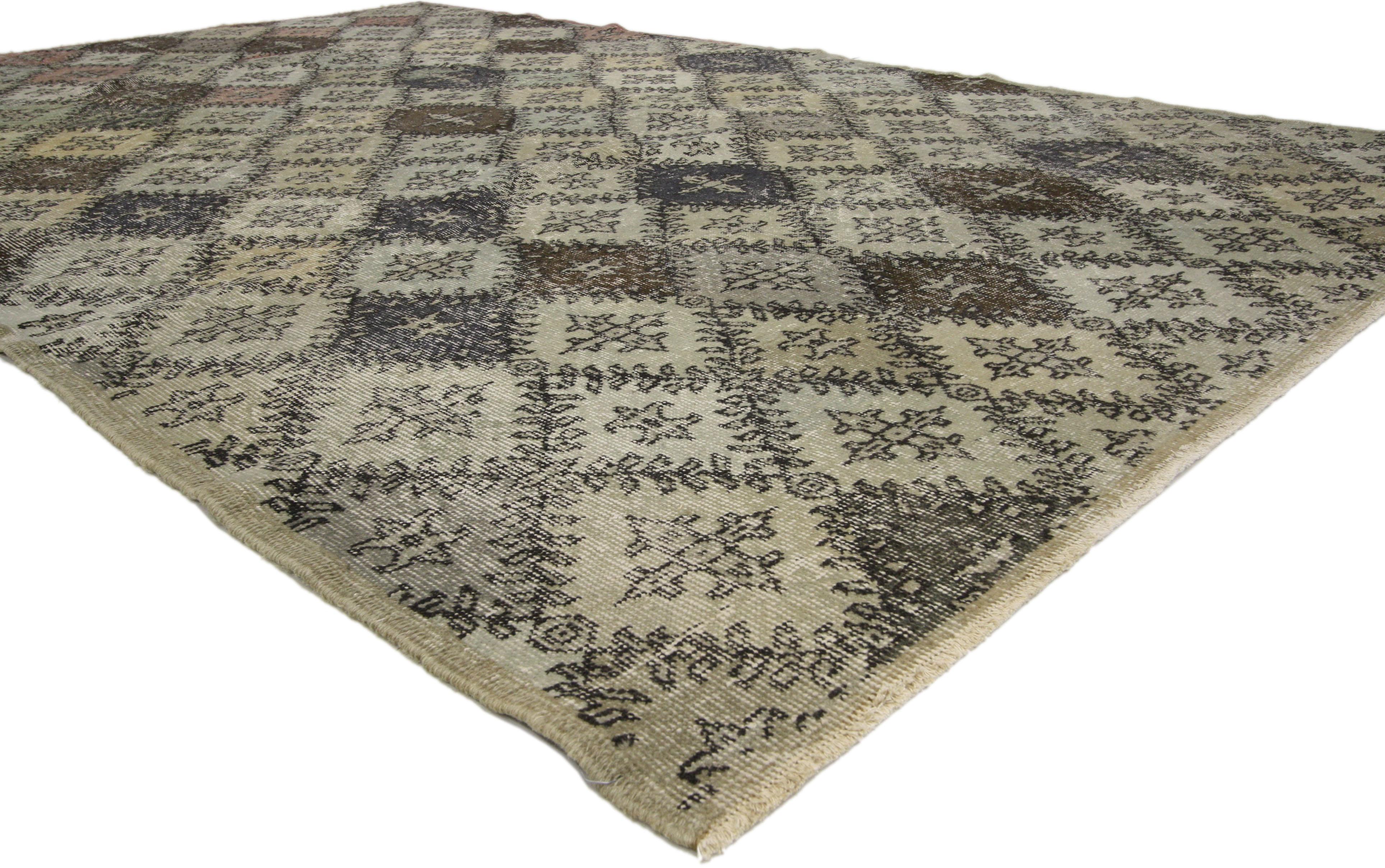 50872 Zeki Muren Distressed Vintage Turkish Sivas Rug with Industrial Art Deco Style 06'02 x 09'10. Warm and inviting combined with a bold pattern, this hand knotted wool distressed vintage Turkish Sivas rug embodies Art Deco style with a modern