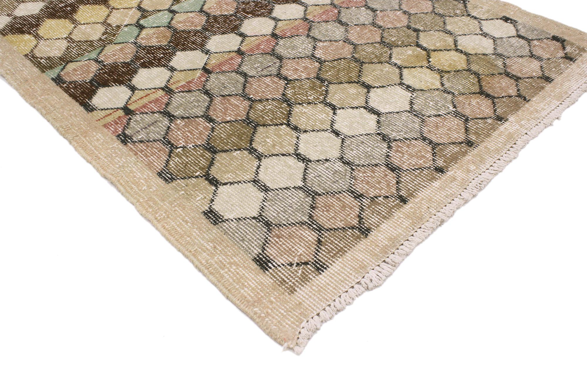 51975 Distressed Vintage Turkish Sivas Rug, 02’11 x 06’03. This hand knotted wool distressed vintage Turkish Sivas rug features a tessellated honeycomb lattice pattern. Reminiscent of Zeki Muren’s designs, the lattice is comprised of offset rows of