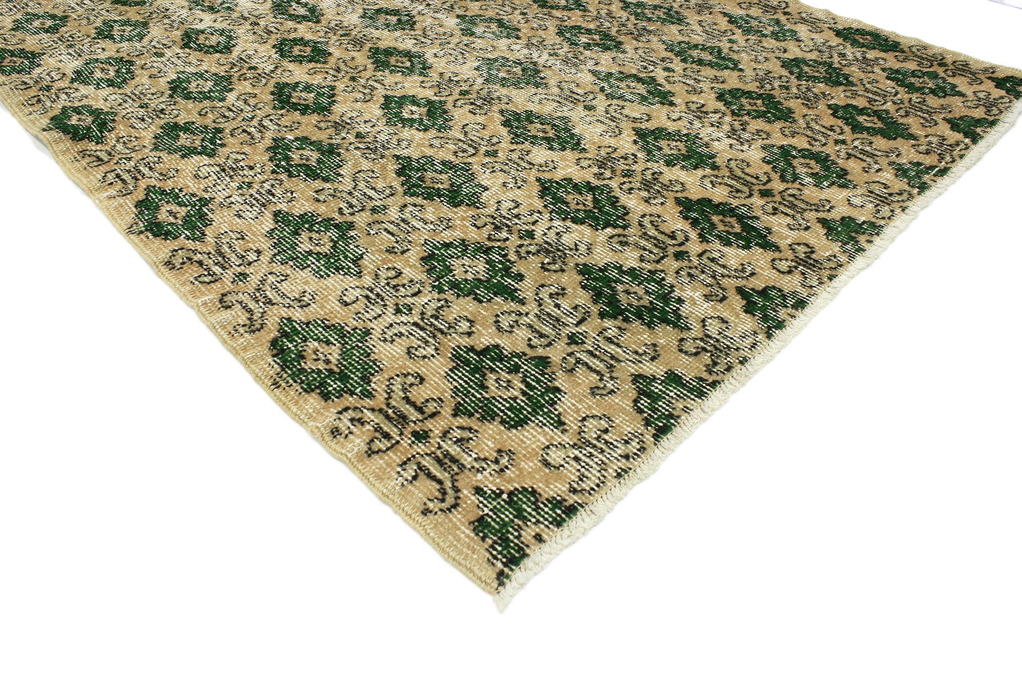 51963 Distressed Vintage Turkish Sivas Rug, 03’03 x 06’01. This hand-knotted wool distressed vintage Turkish Sivas rug presents an intricate all-over pattern featuring small geometric medallions, each delicately framed by stylized floral scrolls.
