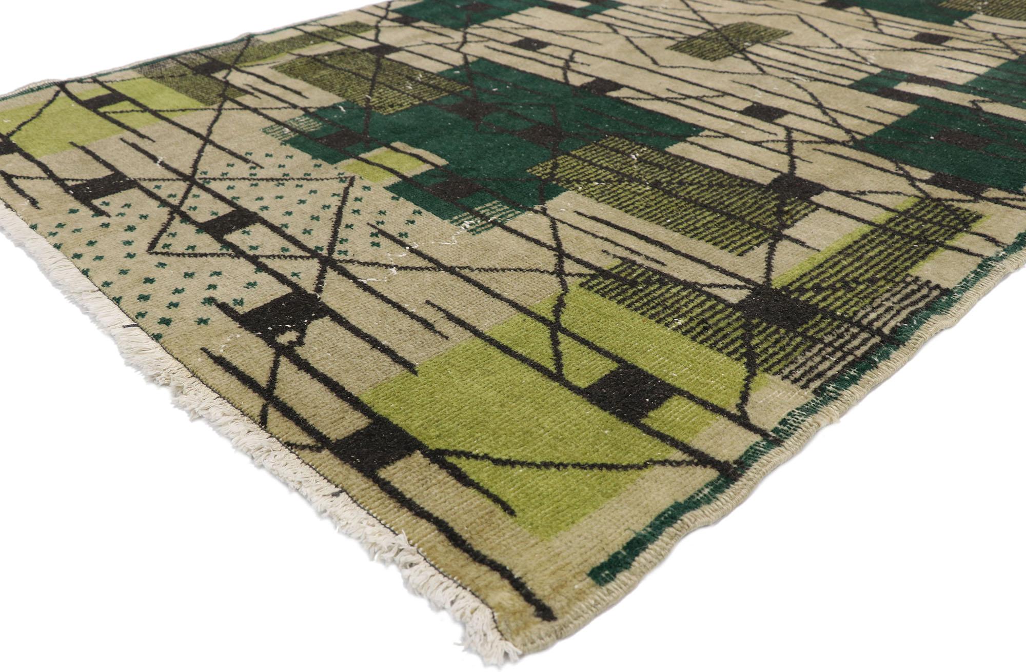 52578 Zeki Muren Vintage Sivas Rug with with De Stijl Mondrian Cubist Art Deco Style. Displaying balanced symmetry and bold geometric shapes combined with a lovingly time-worn composition, this hand knotted wool Zeki Muren distressed vintage Turkish