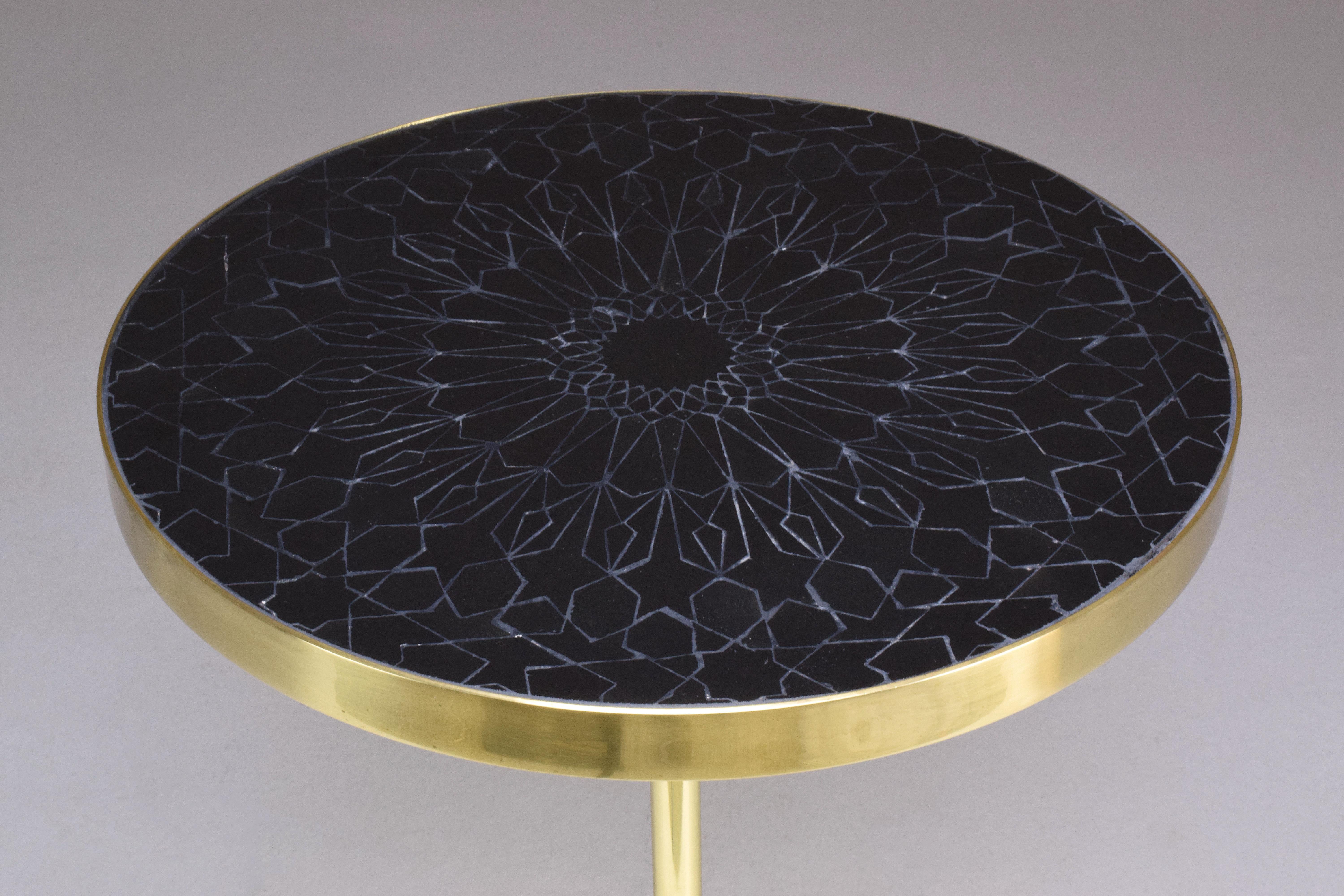 Hand-cut Moroccan zellige is inlaid within a polished brass rim and paired with our AFELLA conical base. The surface reads like jewelry—glazed facets, fine grout lines, and a soft brass halo. Each table is handcrafted; natural variations in the