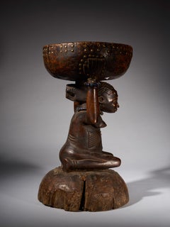 Zela Caryatide Stool held by a Female sculpture covered with with scarifications