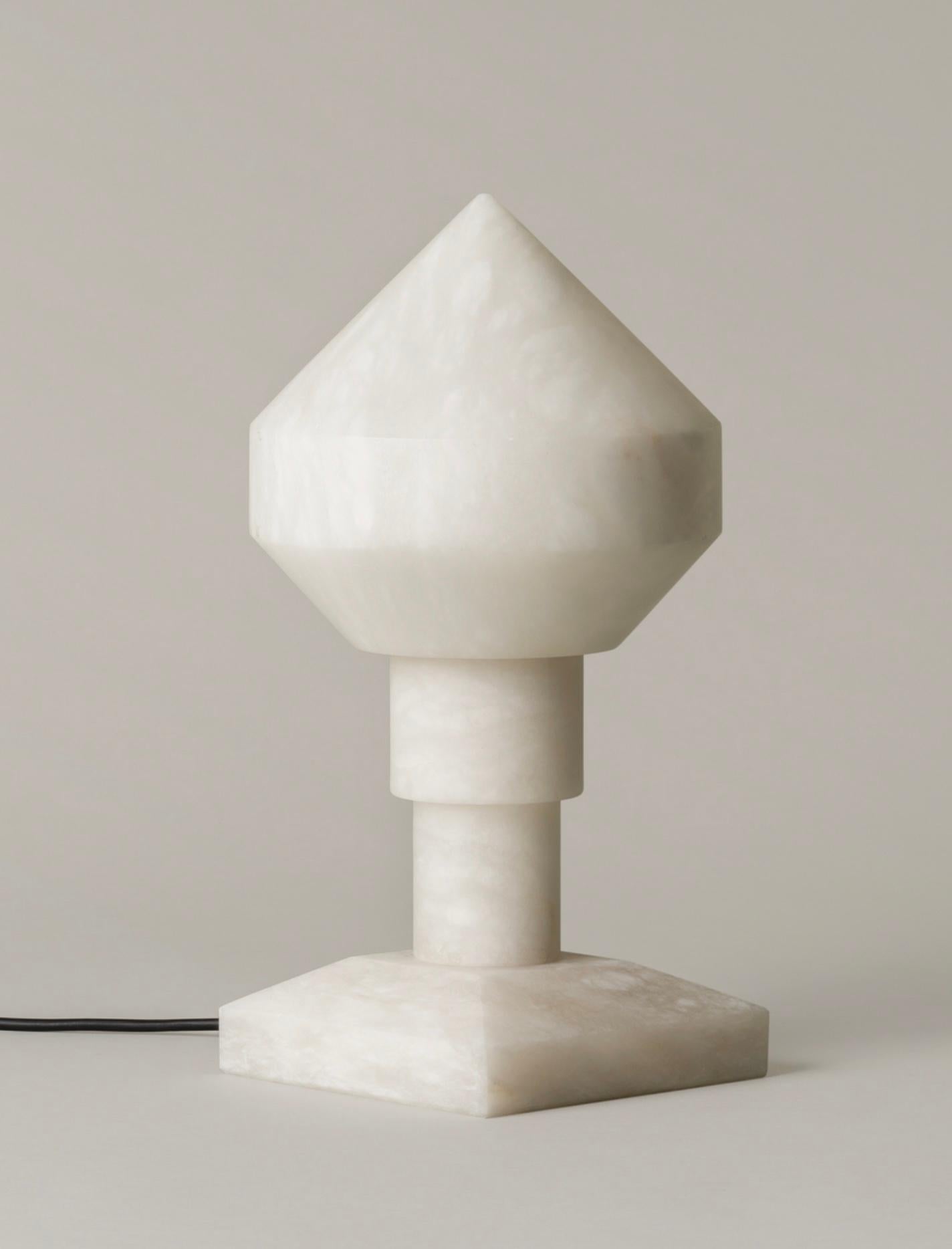 Zeleste table lamp by Àngel Jové and Santiago Roqueta for Santa & Cole. Originally designed in Spain, 1969. Current production available from rewire gallery. Carved, solid, white alabaster, the Zeleste is reminiscent of Barcelona’s night life, with