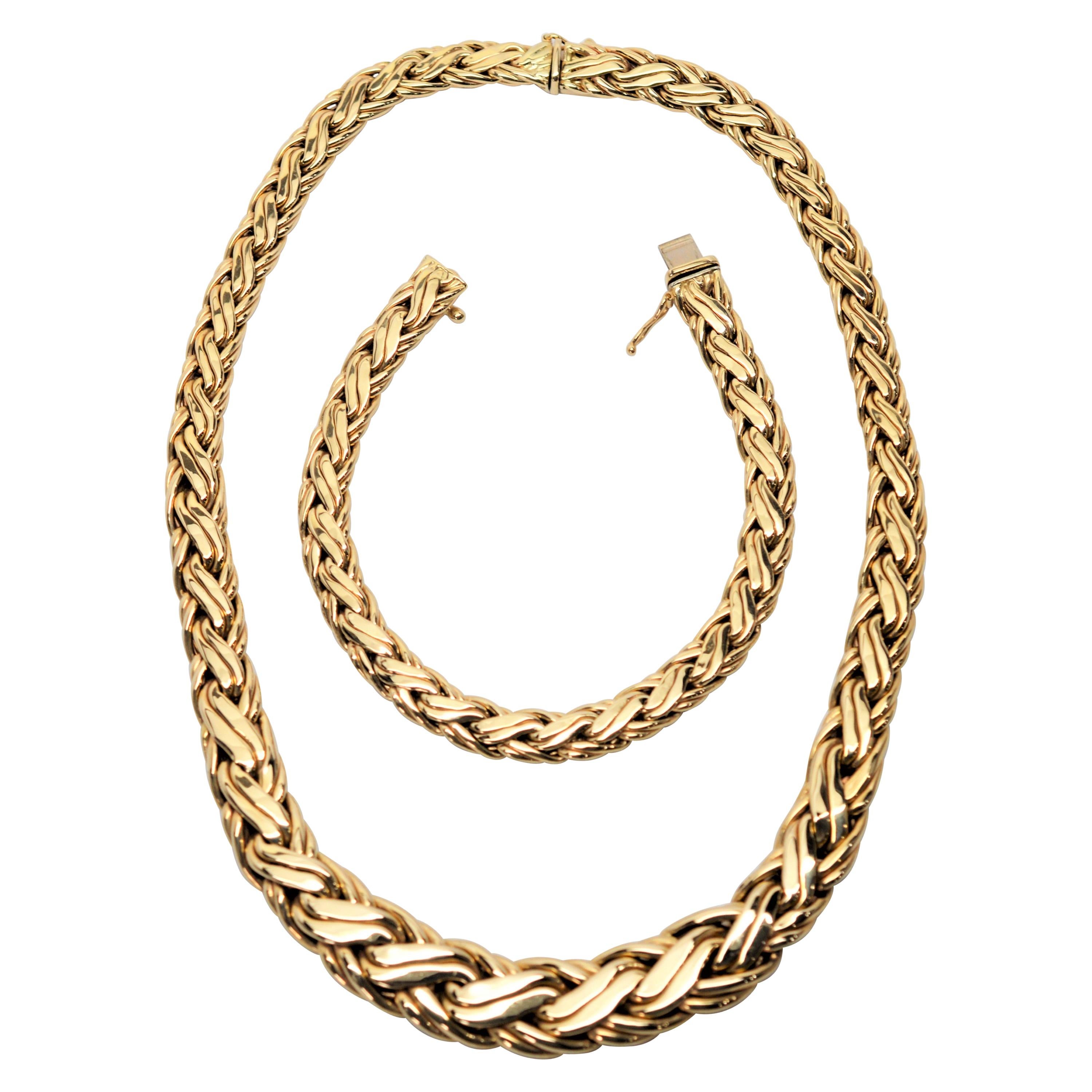 Fabulous matching necklace and bracelet set from Zelman & Friedman (Z&F) Jewelers. Both pieces are of a double braided thick fourteen carat 14K gold and stamped and signed the New York City maker. The graduated collar necklace measures 16 inches