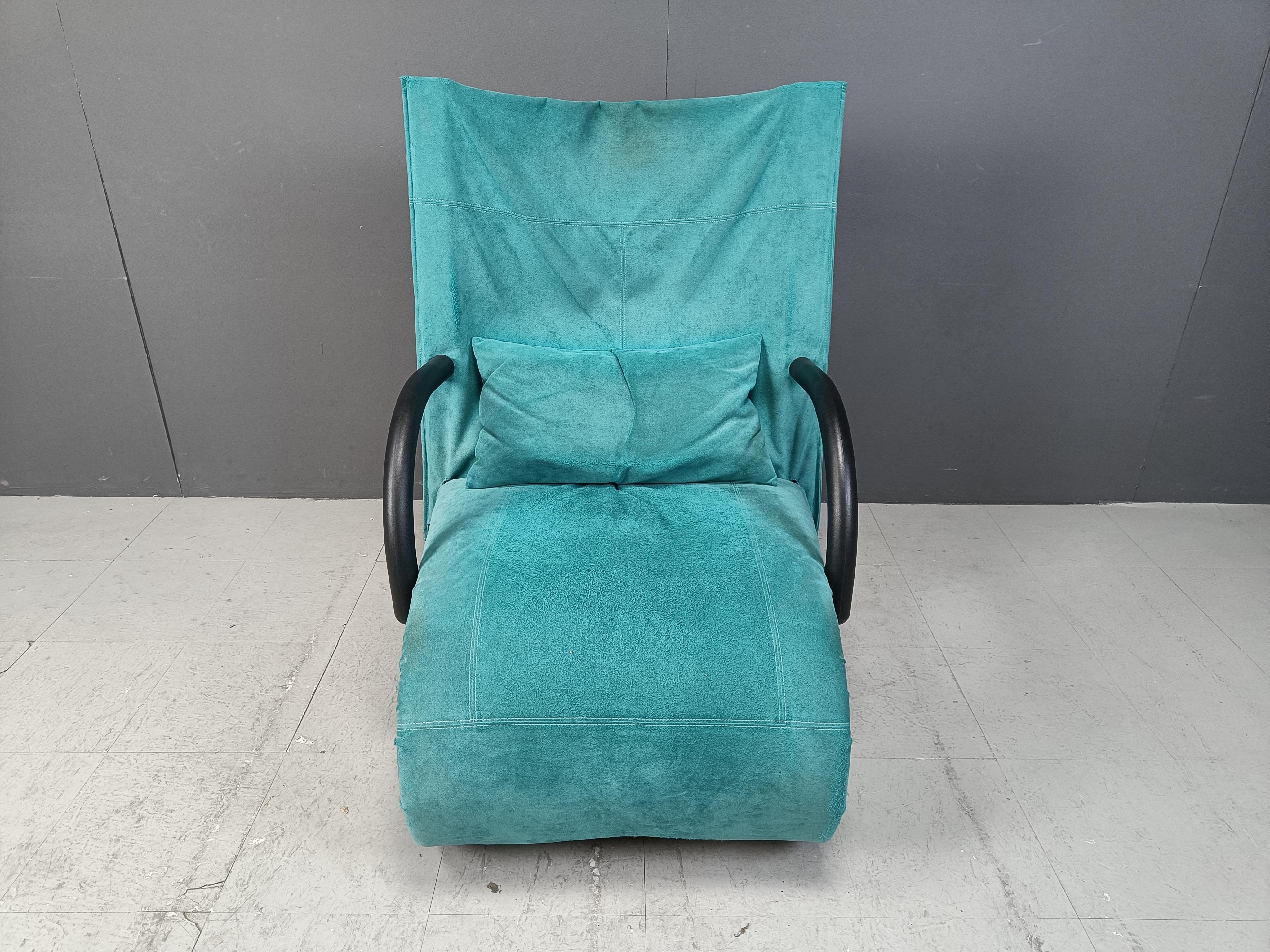 Striking black and blue suede 'Zen' lounge chair with ottoman designed by Claude Brison for Ligne Roset.

Complete with original cushion, this lounge sofa is very very comfortable and has a modern design.

Good condition and vibrant blue