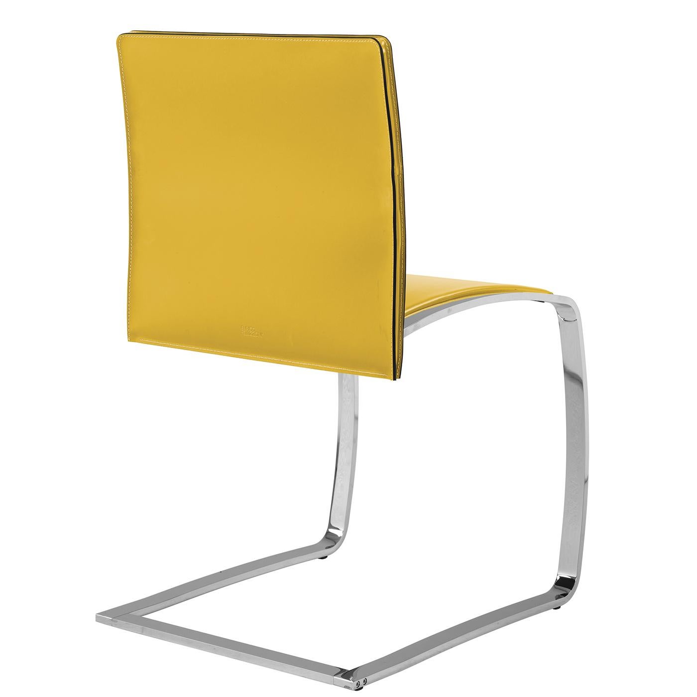 This chair's minimalist lines are synonymous with great elegance, as its super-thin, sinuous profile creates a barely-there silhouette. Its cantilever base of rectangular steel plates has a bright chrome finish. The seat and back are covered with