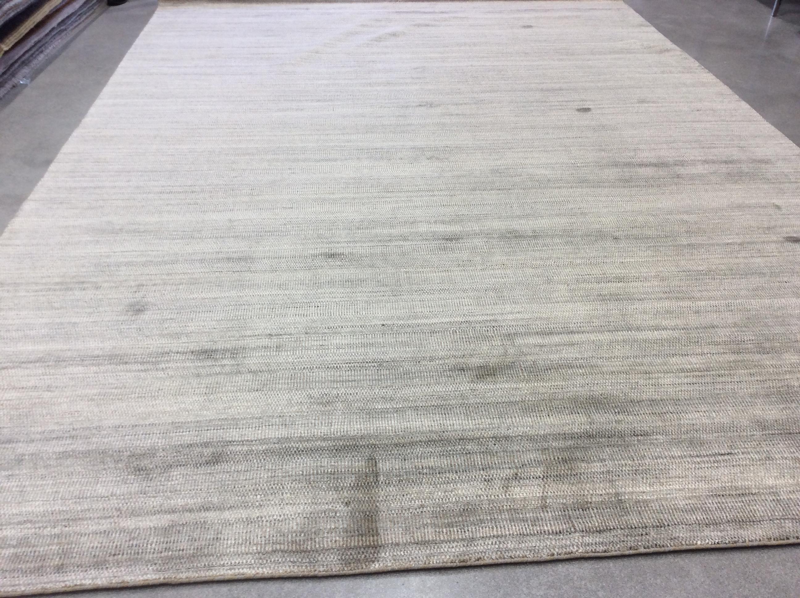 Create a calming atmosphere in any space with this cool beige and silver variation of the popular Zen Collection rugs.  Wool/viscose blend for comfort and durability.  Hand knotted in India.  Made using natural vegetal dyes.  

Additional sizes