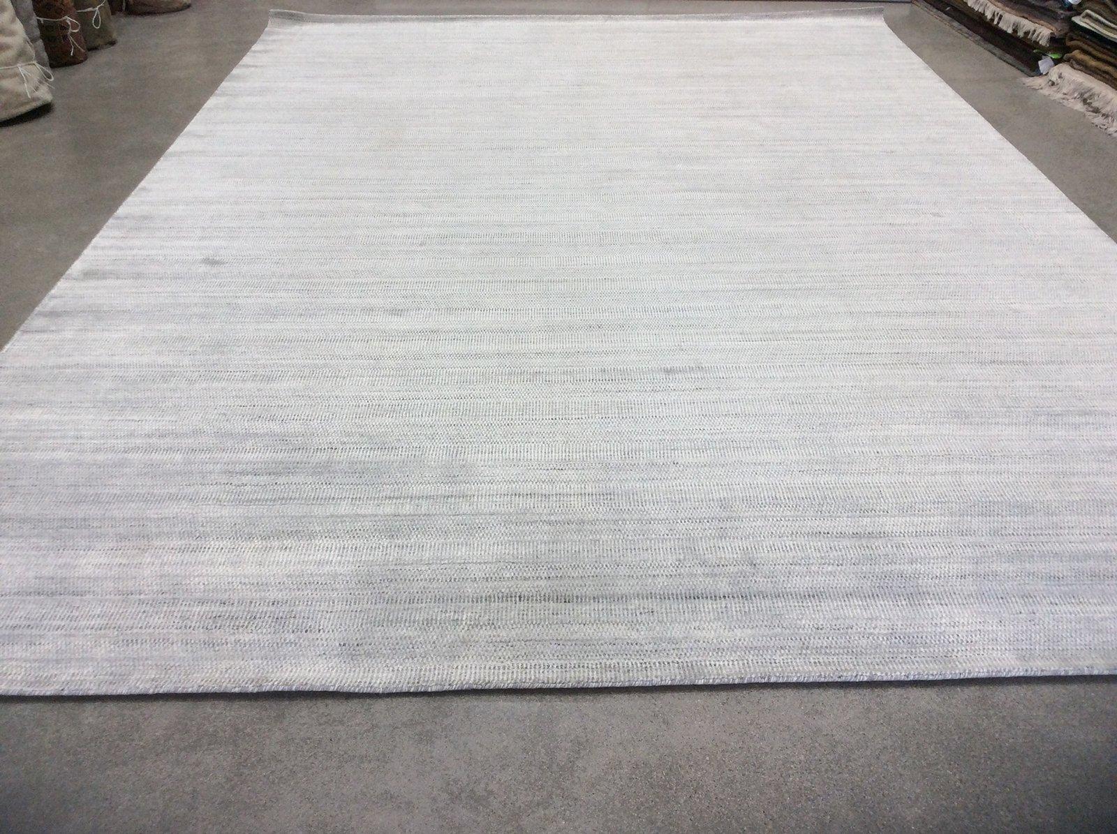Create a calming atmosphere in any space with this cool silver variation of the popular Zen Collection rugs. Wool/viscose blend for comfort and durability. Hand knotted in India. Made using natural vegetal dyes. 

Additional sizes available.