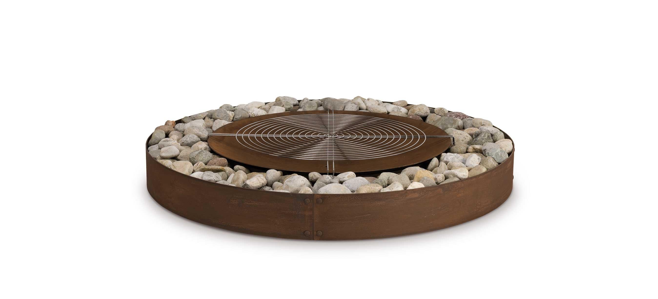 Zen fire pit by AK47 Design.

Steel fire pit Ø1800 mm.
Zen is a wood-burning outdoor fire pit with a round steel crown and built-in brazier. Stone, gravel, volcanic stones and sand are just some of the natural elements that may be used to