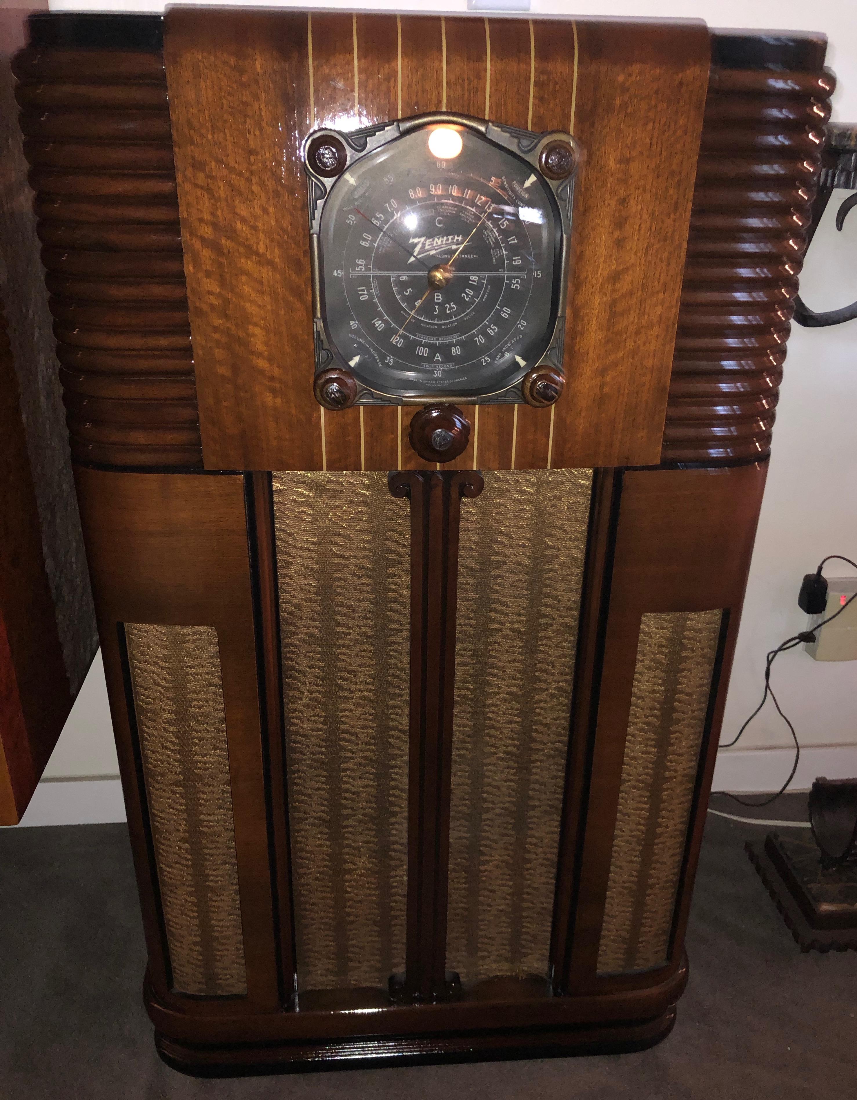 This is an uncommon and super playing Zenith ten-tube console radio, ready for you to proudly display and listen to. The sculpted ribs on the sides are an outstanding feature, and the design was patented. From the Golden Age of Radio.

The