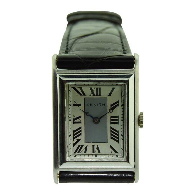 FACTORY / HOUSE: Zenith Watch Company
STYLE / REFERENCE: Art Deco / Tank 
METAL / MATERIAL: 18kt Solid White Gold
CIRCA / YEAR: 1930's
DIMENSIONS / SIZE: Length 38mm X Width 25mm
MOVEMENT / CALIBER: Manual Winding / 15 Jewels / Cal.888
DIAL / HANDS: