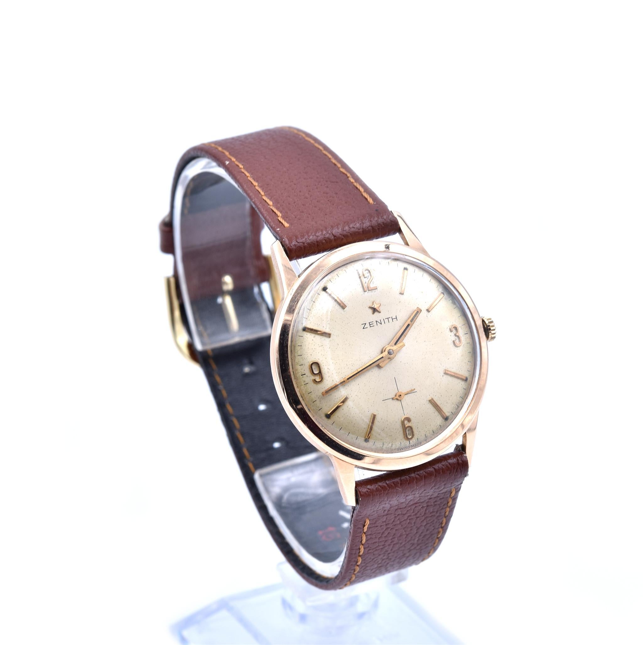Movement: manual winding
Function: hour, minute, small seconds
Case: 34mm 18k rose gold case, plastic crystal
Band: brown leather strap with tang buckle
Dial: gold dial with Arabic numerals, gold tone hands
Calibre #: 2541	
Jewels #: 17

No Box or