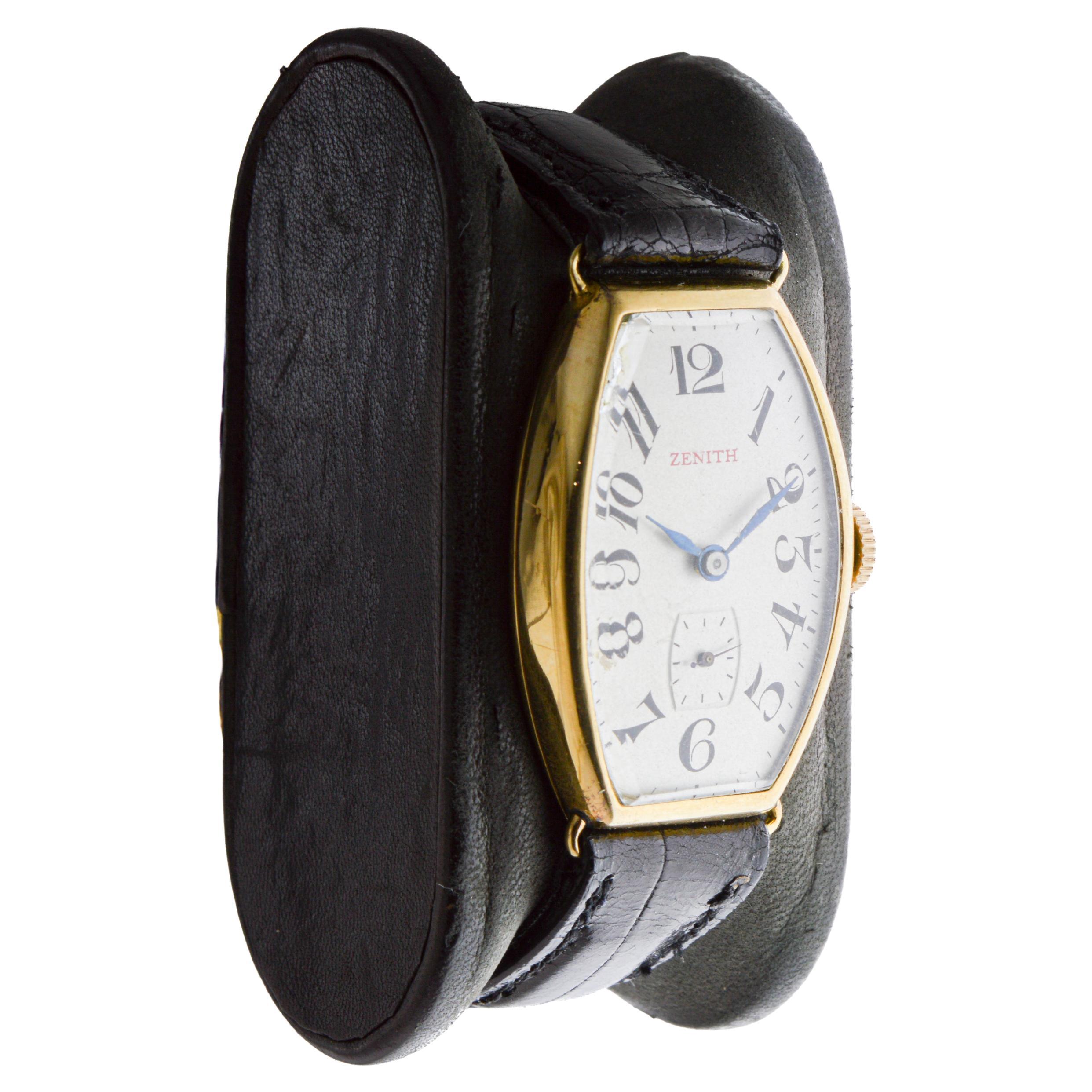 FACTORY / HOUSE: Zenith Watch Company
STYLE / REFERENCE: Art Deco / Tonneau / Curvex
METAL / MATERIAL: 18Kt Solid Gold
CIRCA / YEAR: 1930's
DIMENSIONS / SIZE: Length 41mm X Width 24mm
MOVEMENT / CALIBER: Manual Winding / 17 Jewels  
DIAL / HANDS: