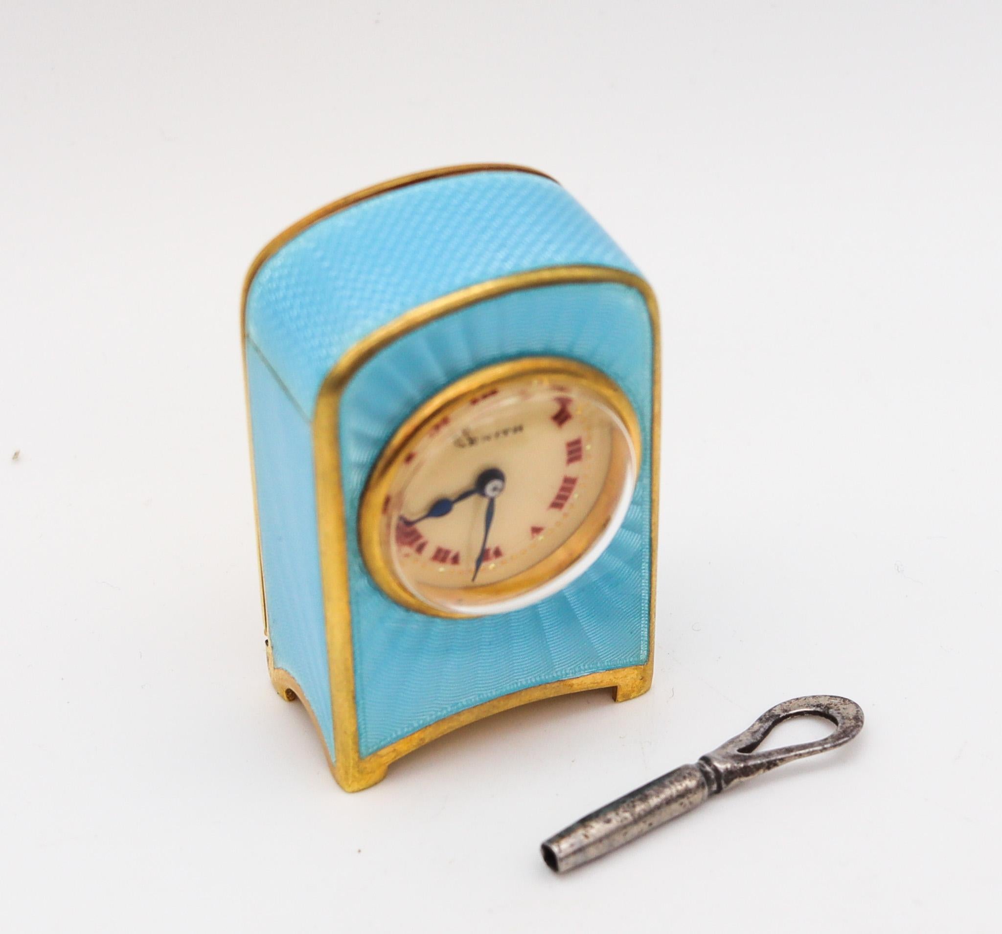 A miniature travel clock designed by Zenith.

Gorgeous miniature travel-carriage clock, made in Geneva Switzerland by Zenith. This little antique clock is exceptional, created during the Edwardian period, back in the 1910. It was crafted with