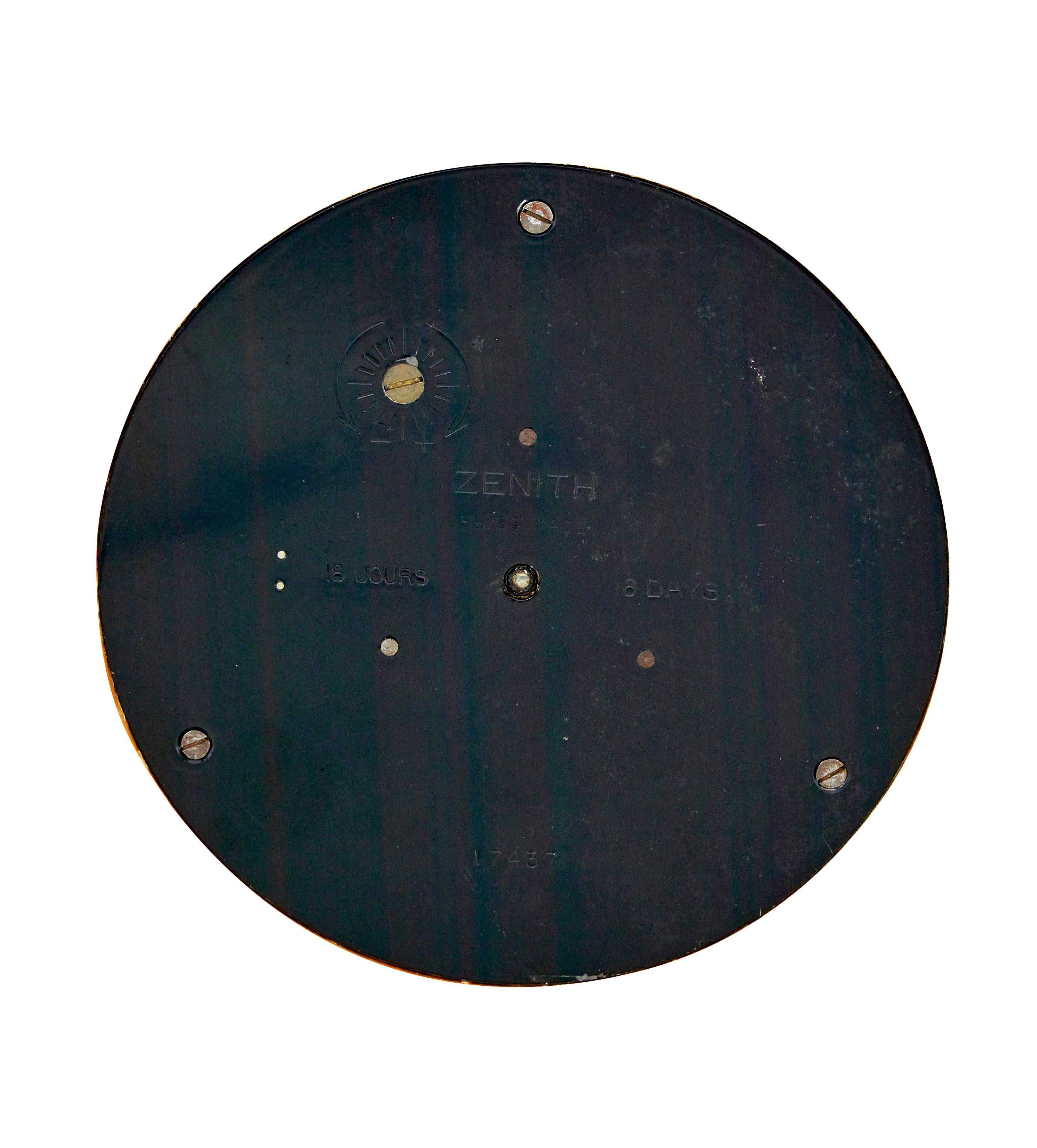Zenith art deco burr and brass wall clock circa 1930.

Well known art deco swiss made wall clock retailed by heal's in the 1930's.  Slight convex shaped round clock face veneered in a burr walnut.  Decorated with applied brass numerals and