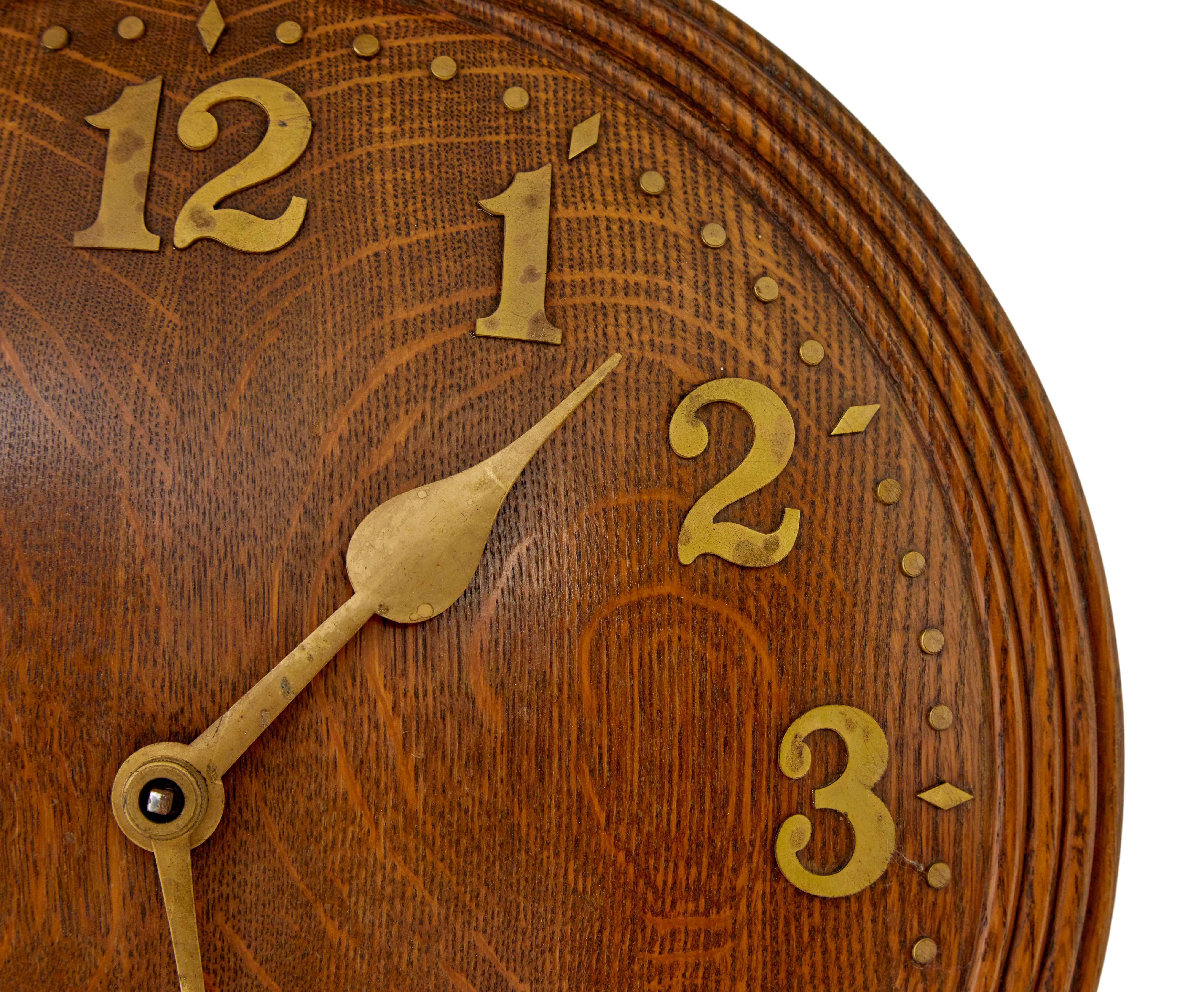 Zenith art deco oak wall clock circa 1930.

Well known art deco swiss made wall clock retailed by heal's in the 1930's.  Convex shaped round clock face with moulded edge.  Decorated with applied brass numerals and hands.

Fitted with a swiss made 18
