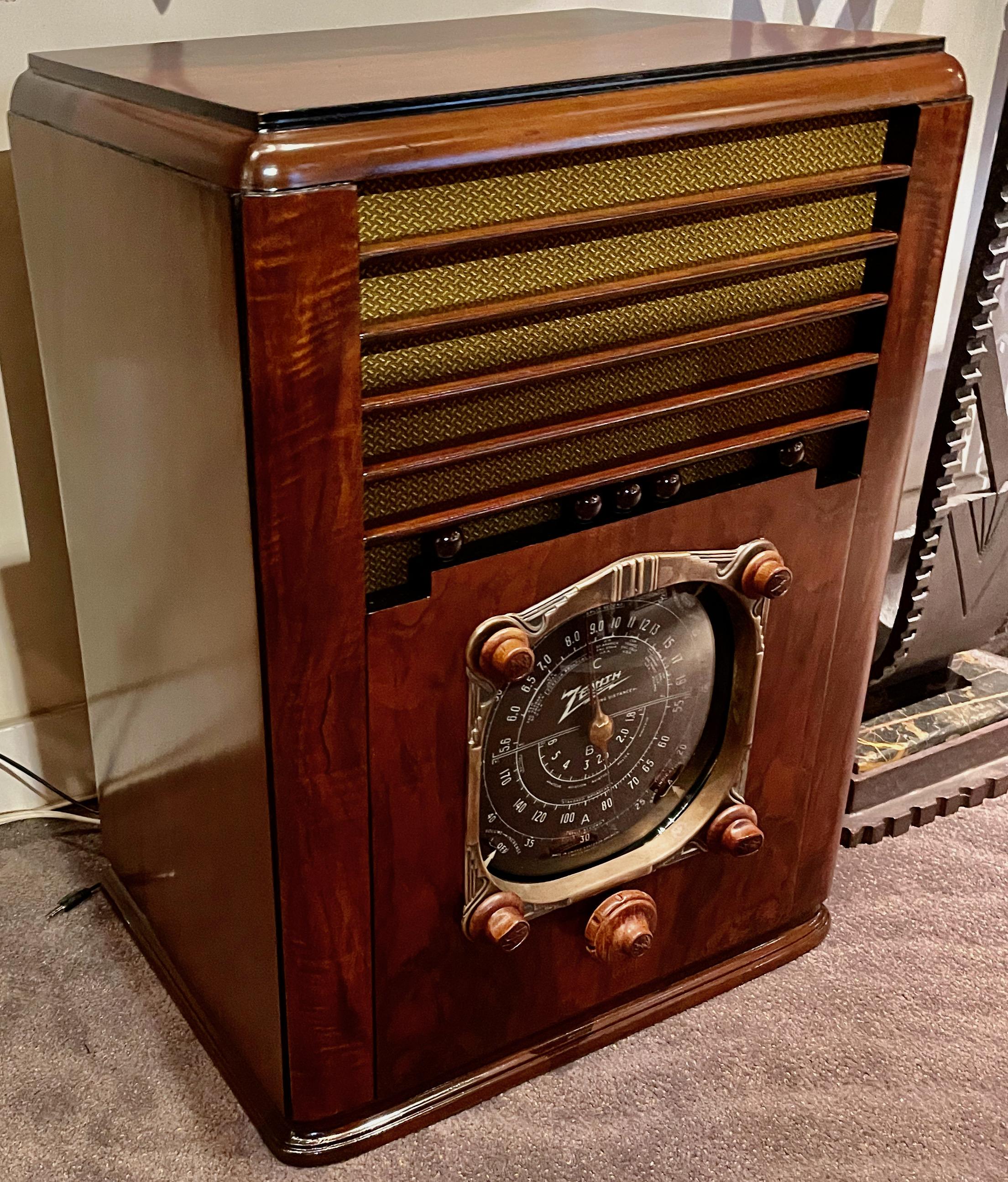 The Art Deco Zenith six-tube large broadcast/short wave radio will be a highlight of any vintage radio collection. It retains the original rare and perfect model 49-117 speaker, the original wooden knobs, bezel, dial glass, and dial scale, all in