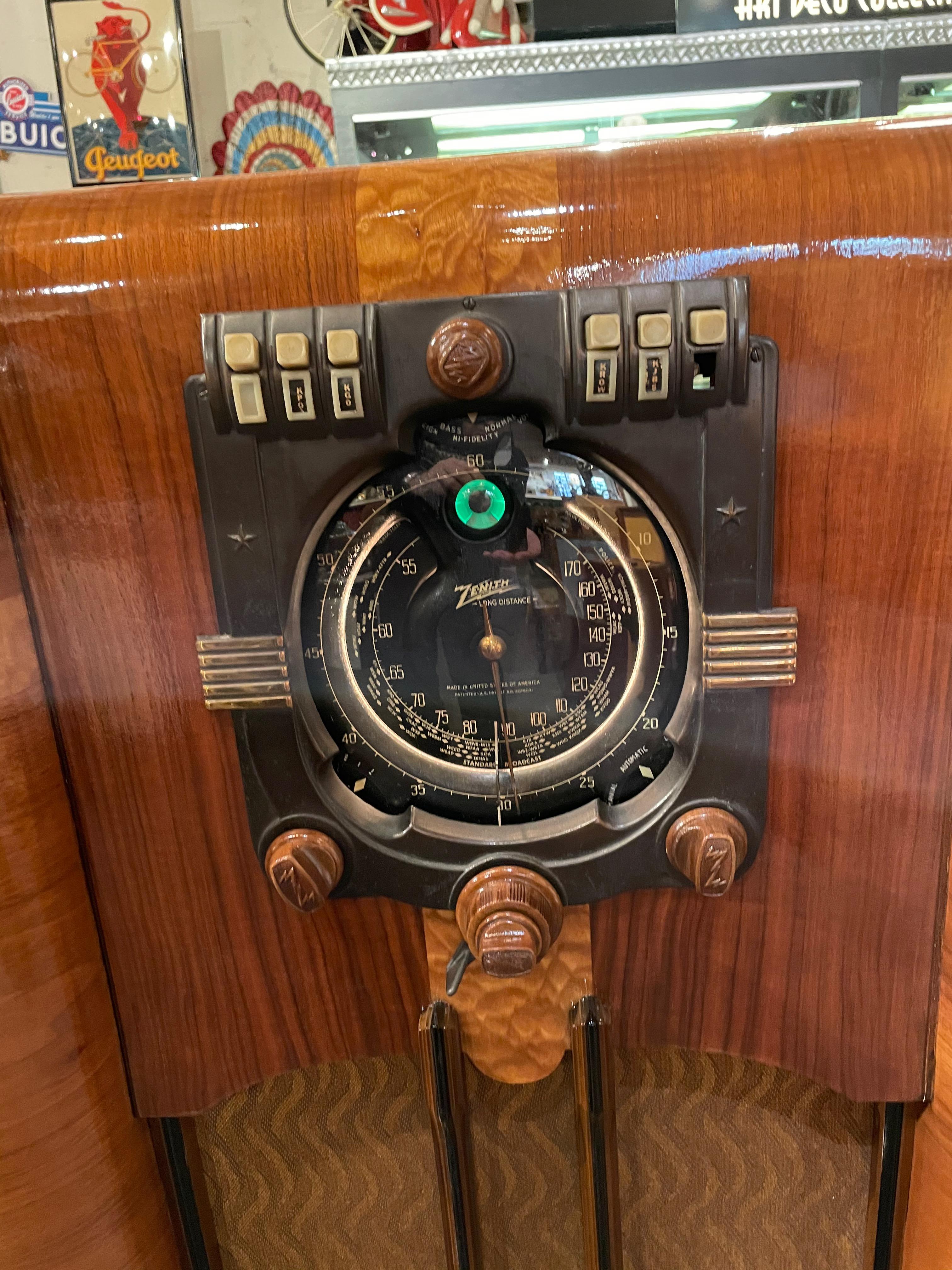 Original 1939 Zenith 9-Tube with a large acoustic adapter speaker. Sought after black Shutter Dial Model 9-S-365 Serial # R90645906. Sometimes described as a ‘World Fair’ model (1939) and/or ‘stars and bars” patriotic model. The larger 9-S-365,