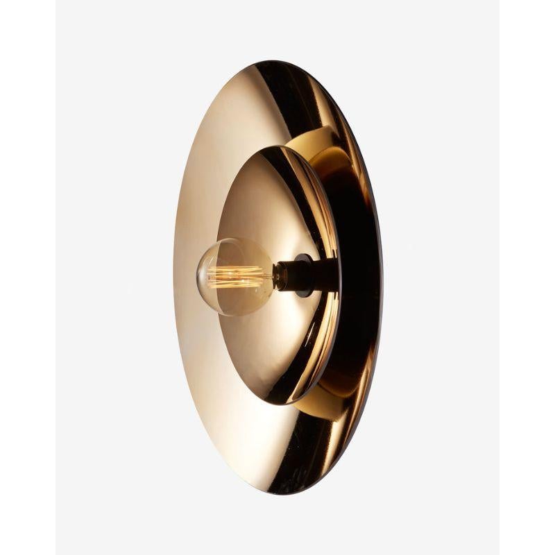 Zénith Double wall light, Gold by RADAR
Design: Bastien Taillard
Materials: Thermoformed gold glass, metal.
Dimensions: depth 20 x diameter 70 cm

Also available: in silver or bronze. Solid oak or in black metal structure.

All our lamps can