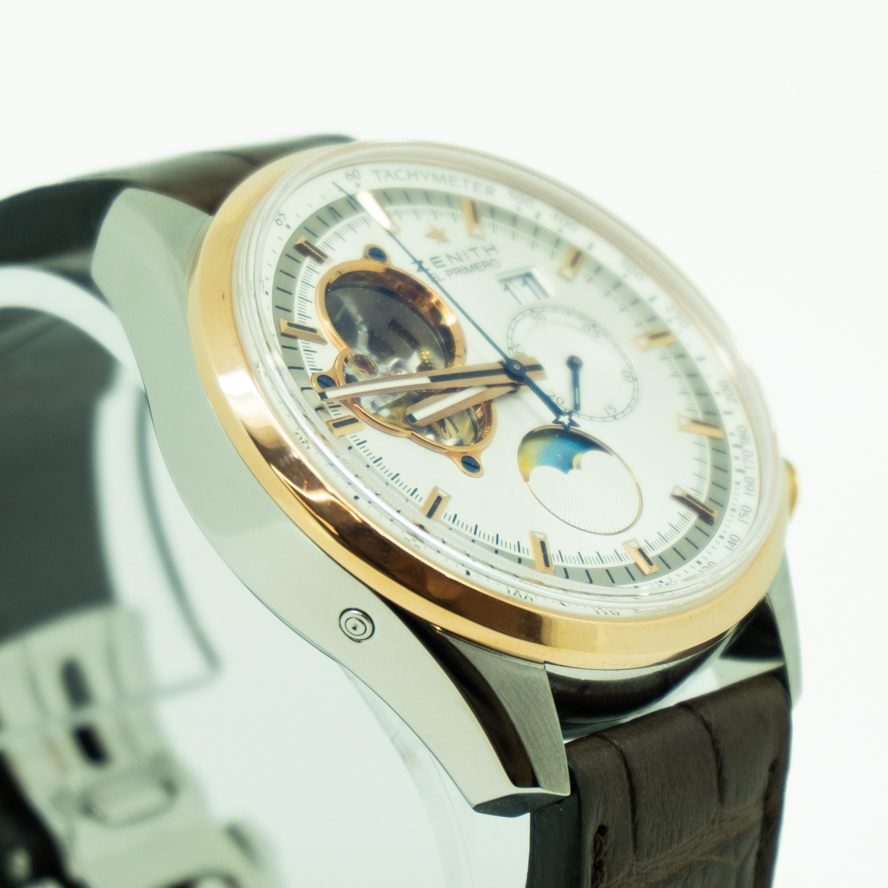 Zenith El Primero Chronomaster 18kt gold and stainless steel 42mm case with 18k rose gold crown and pushers.
18k rose gold bezel.
Silver colored dial with index hour markers and cutaway exposing movement.
Hours, minutes, seconds, power reserve