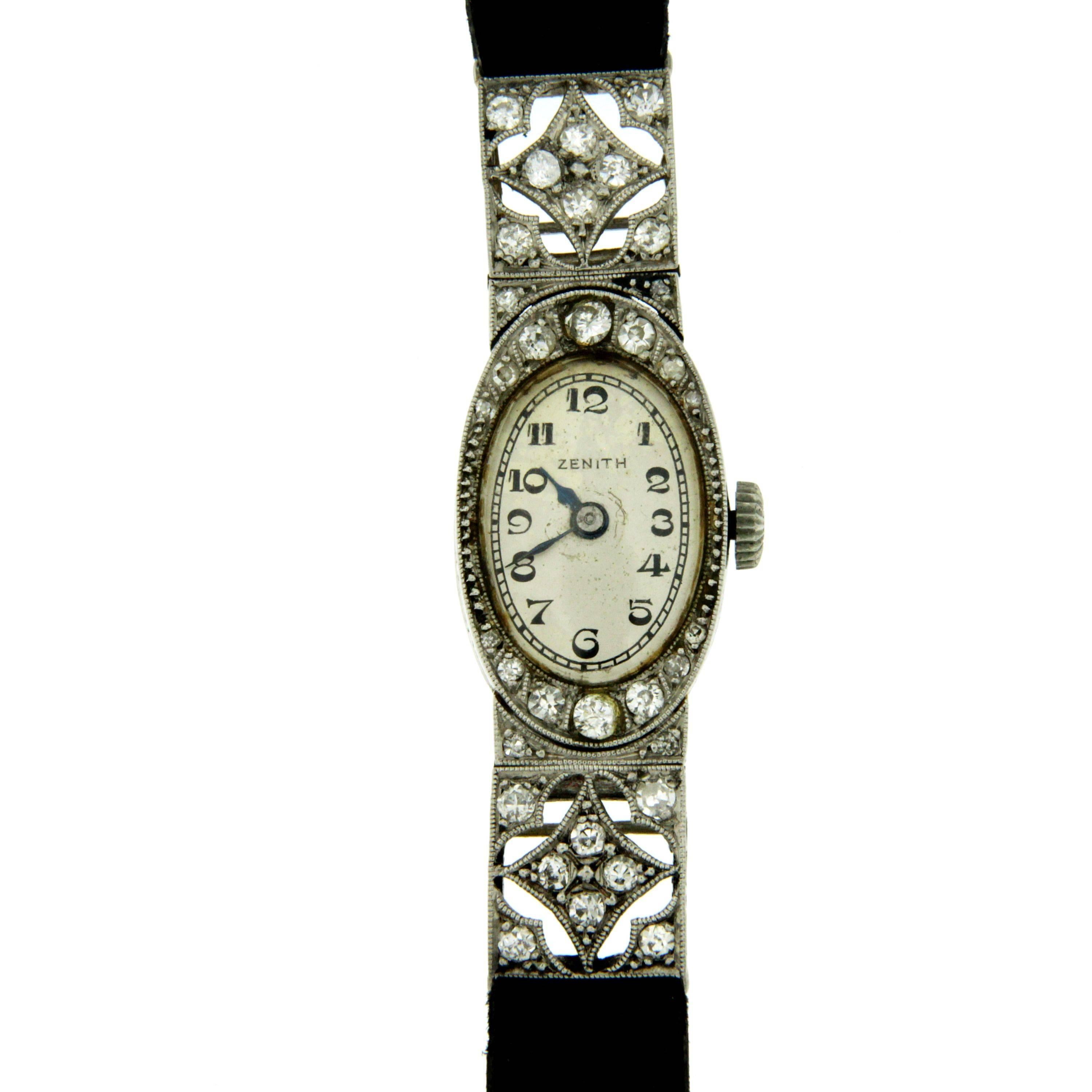 A stunning Zenith 1930's Art Deco Platinum and diamond wrist watch.
Diamonds are inlayed throughout the entire head of the watch and extend to part of the band. The face is bordered in old cut diamonds G-H color Vvs clarity. Estimated total diamond