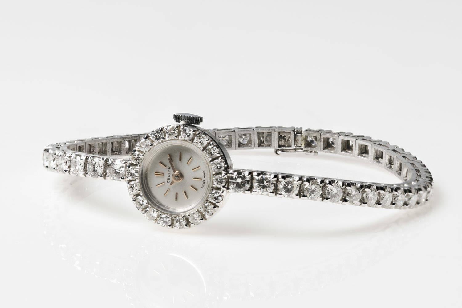 A Lady's Swiss diamond wristwatch, the 1960's vintage cocktail watch with manual Zenith movement, the bracelet and watch bezel fully set with 90 brilliant cut diamonds.
Bezel Diameter: 14.8 mm
Inside Diameter: 6.5 mm
Diamonds Weight 1.80 carat.