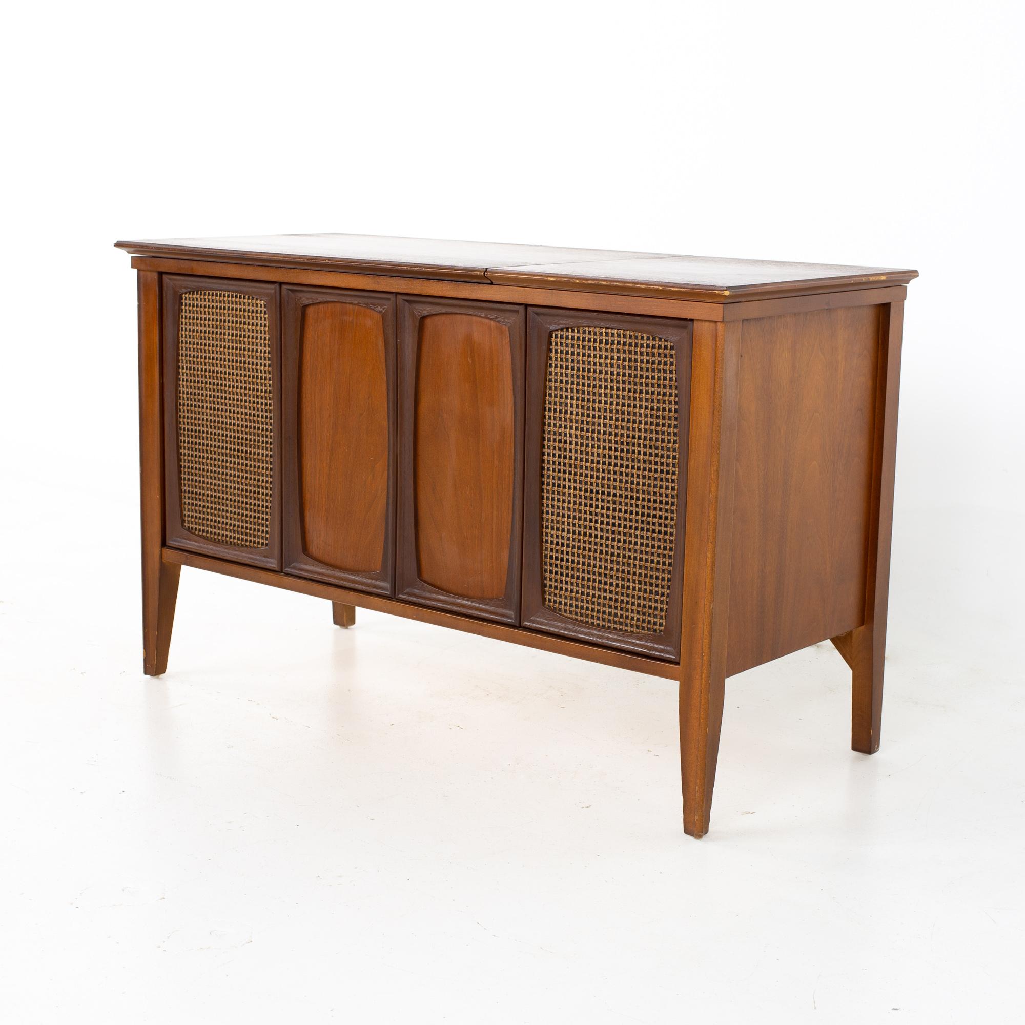 Zenith mid century walnut stereo record console
Record console measures: 40.25 wide x 17.5 deep x 25 inches high 

All pieces of furniture can be had in what we call restored vintage condition. That means the piece is restored upon purchase so