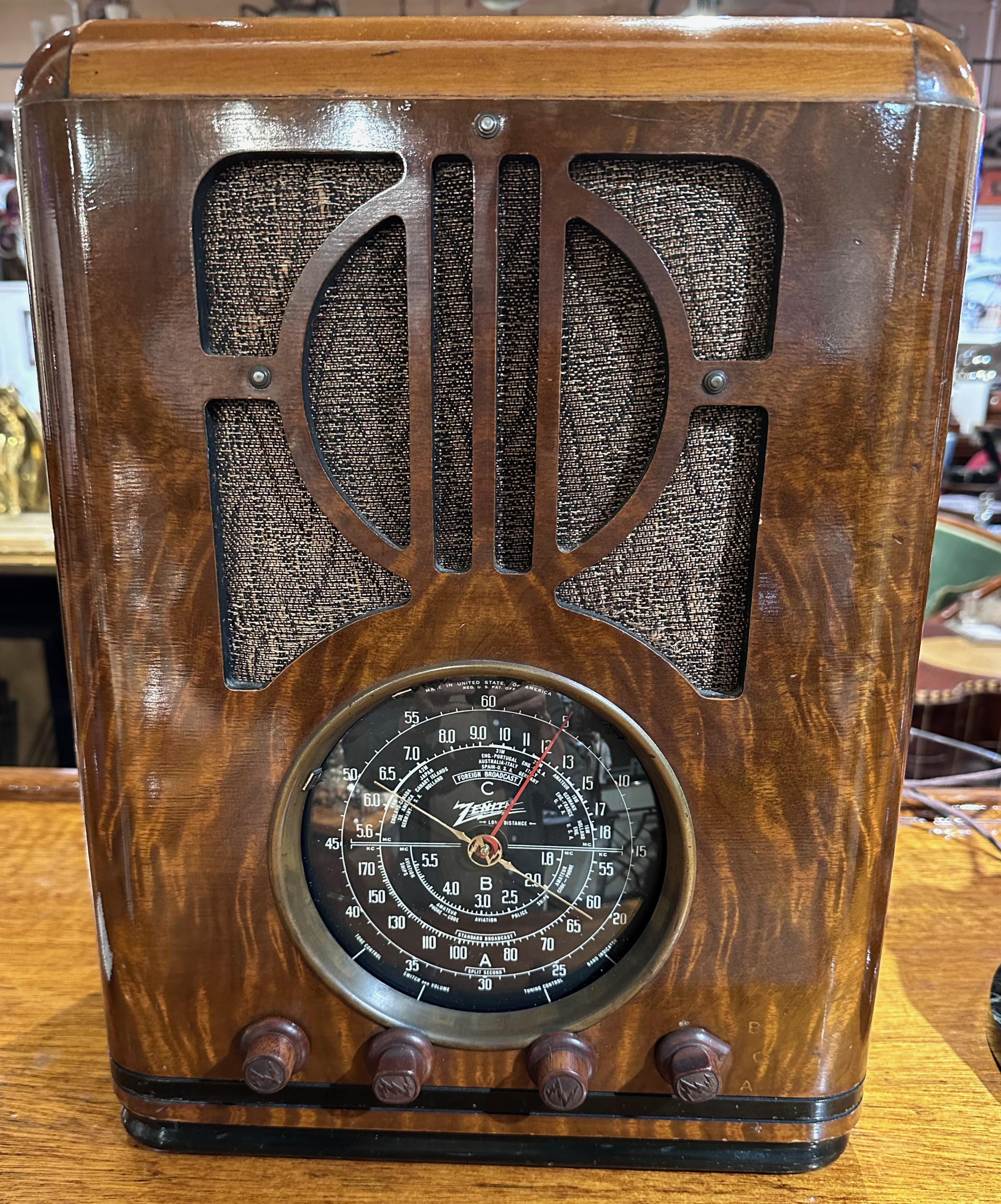 Zenith Model 6-S-229 Tombstone Radio (1938) With Adapter for Bluetooth. Zenith 6-S-229 black-dial tombstone is one of
several similar models where the front and sides of the cabinet are covered with FAUX finish, a paper-like film printed & textured