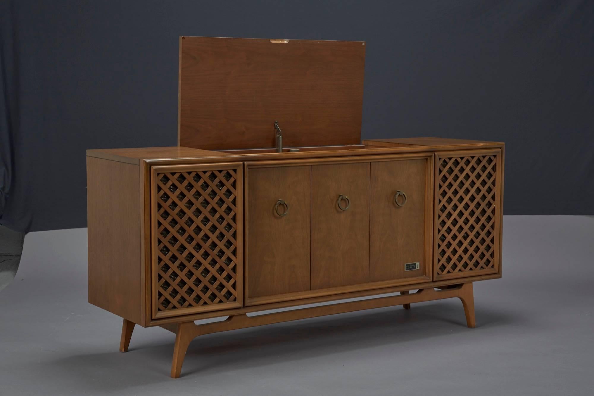 Zenith stereophonic stereo cabinet with record player and working radio. Produces rich, stereophonic sound. Minor fix to turntable needed to operate.
