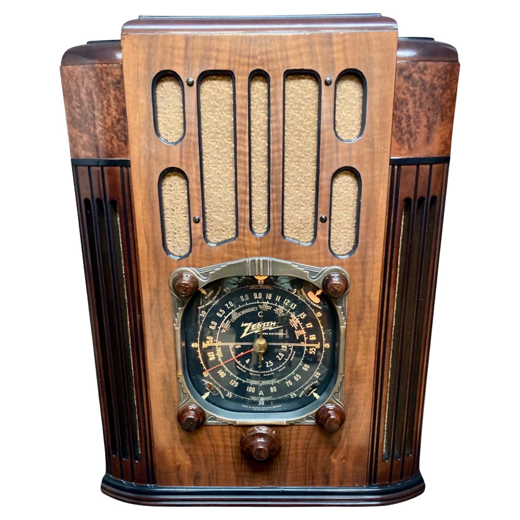 The 10-S-130 (10S130) is a large and commanding tombstone radio that was Zenith’s top-of-the-line table model for 1937. The focal point when viewing the cabinet is indisputably the “squared-circle” edition of the “big black dial“. This is gracefully