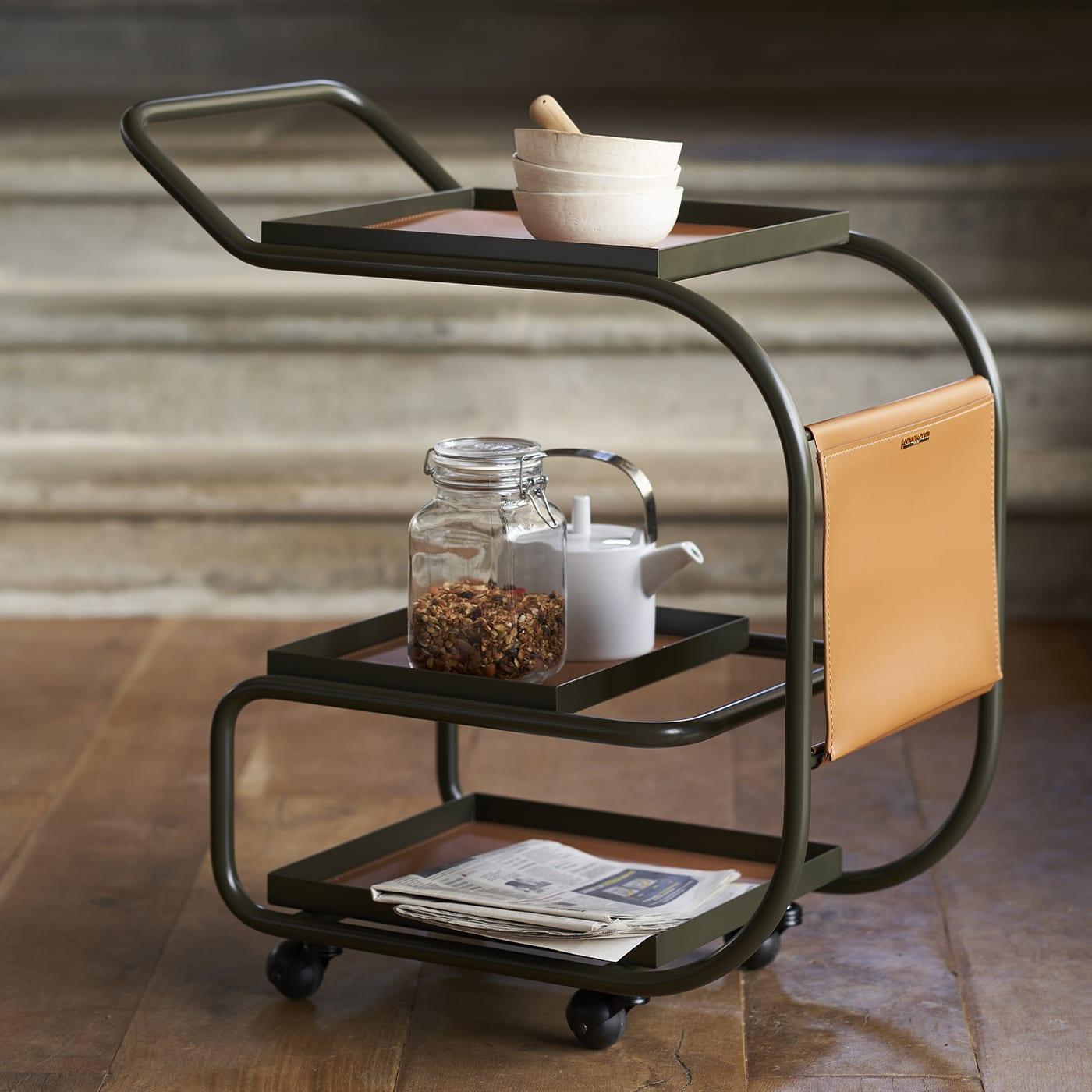 This superb bar cart is perfect for serving tea or sharing a drink with guests after a long day or on a relaxing weekend. Its tubular steel frame finished in a dark-green lacquer boasts a sinuous shape where three rectangular trays are fitted - one