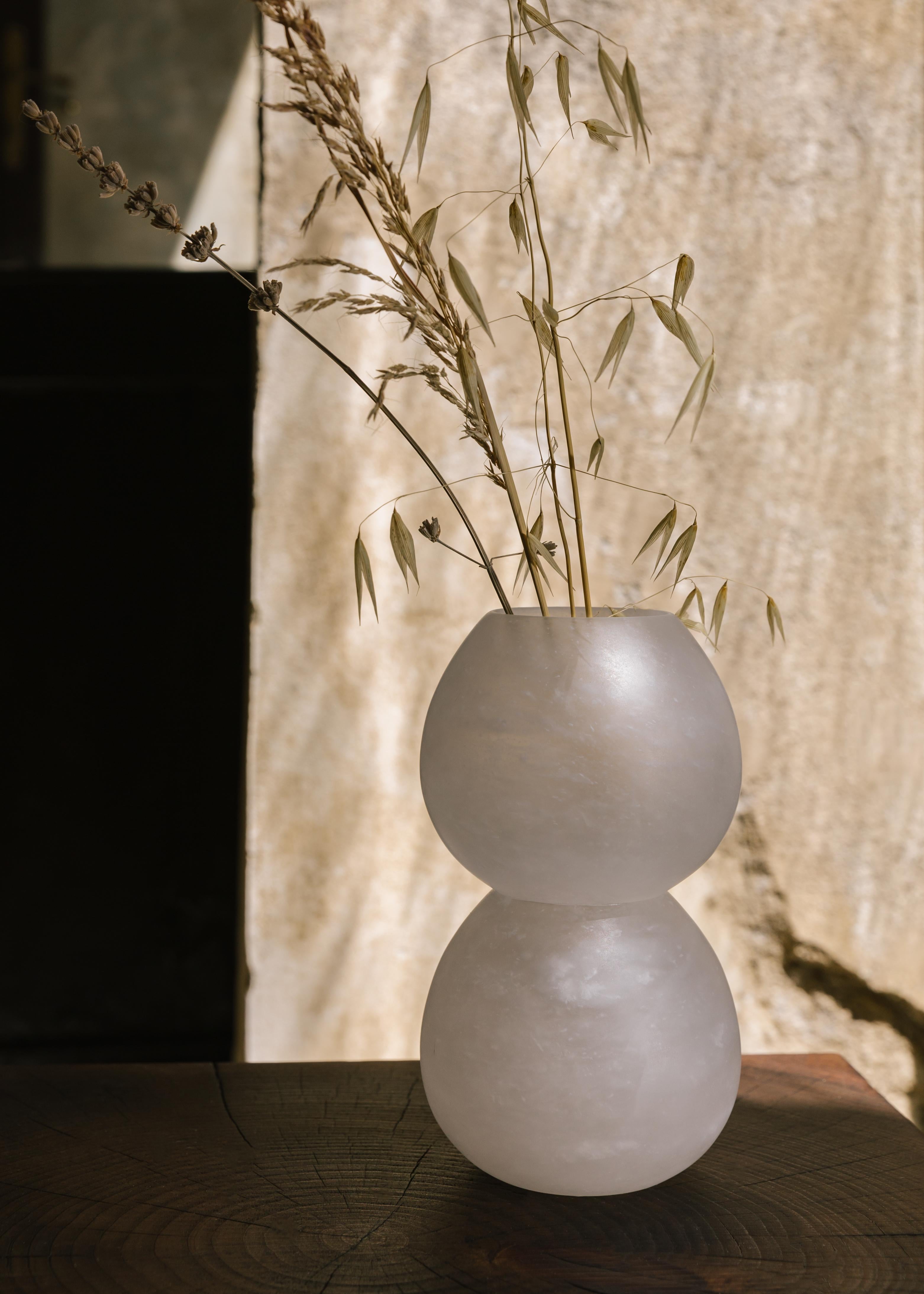 Zeri vessel by Karu
Dimensions: D 12 x H 22 cm
Materials: alabaster.

Contemporary Vessels inspired by Etruscan Antiquity.
Handcrafted in the hills of Tuscany.

Award-winning design firm Karu debuts its latest limited edition home accessories