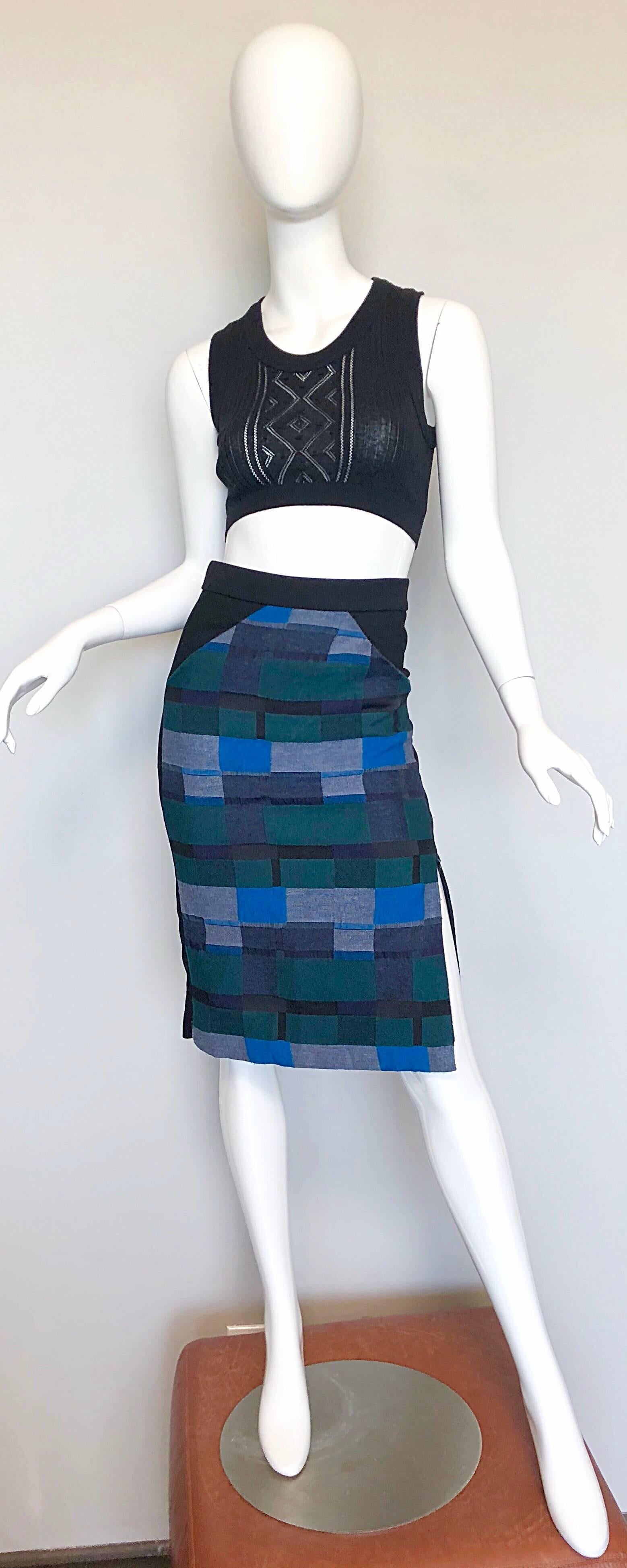 From Maria Cornejo's debut collection in 1998, comes this 
ZERO + MARIA CORNEJO high waisted block print pencil skirt! Features a soft wool blend with warm colors of blue, teal, and green throughout the front. Solid black back. Pockets at each side