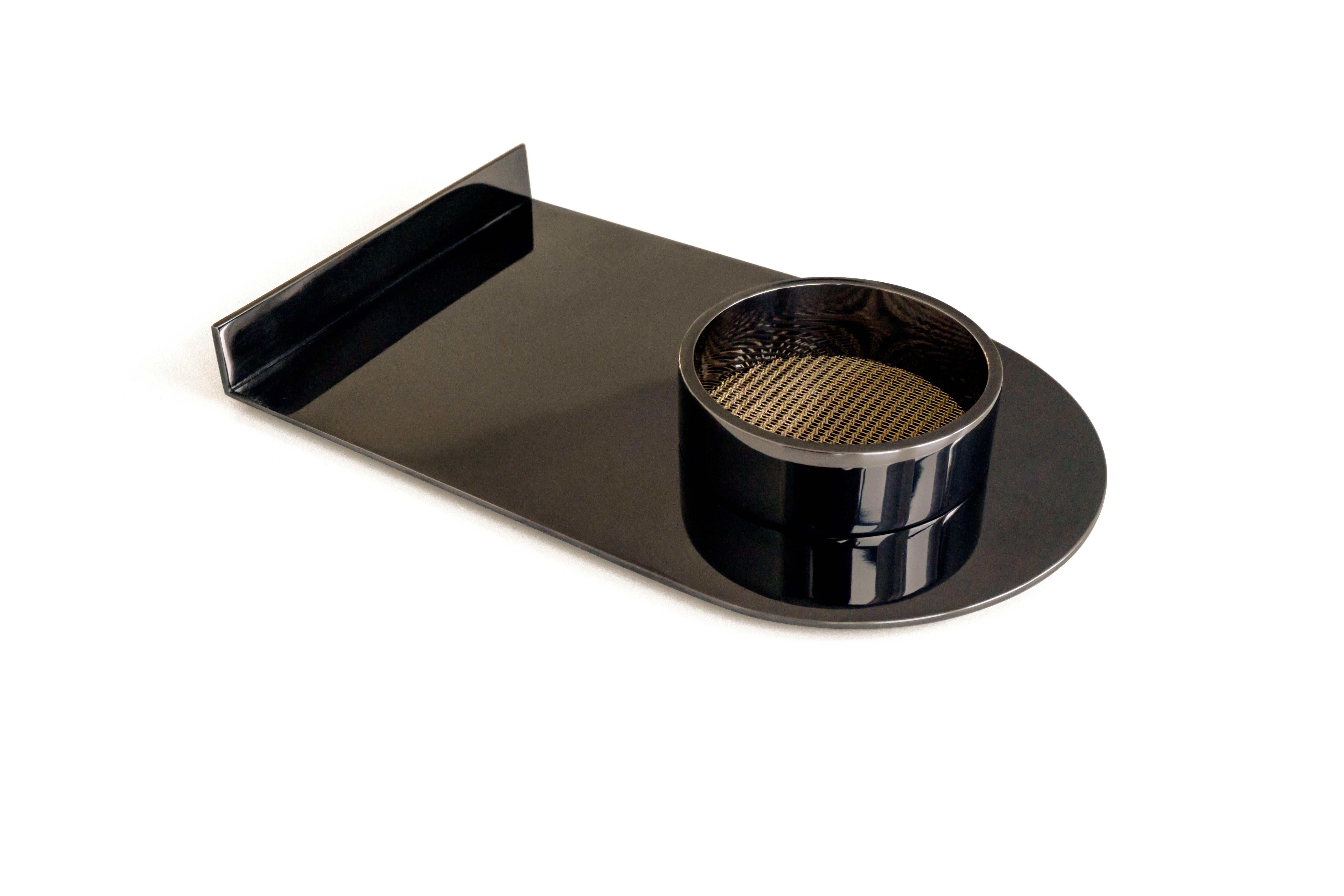 ZERO valet tray in a black polished Nickel with a bronze mesh insert to catch the finest of jewels, keys or special trinkets. The valet tray is the perfect fit for a foyer, desk, vanity or a decorative accessory/object

Designed by OA 

Also,